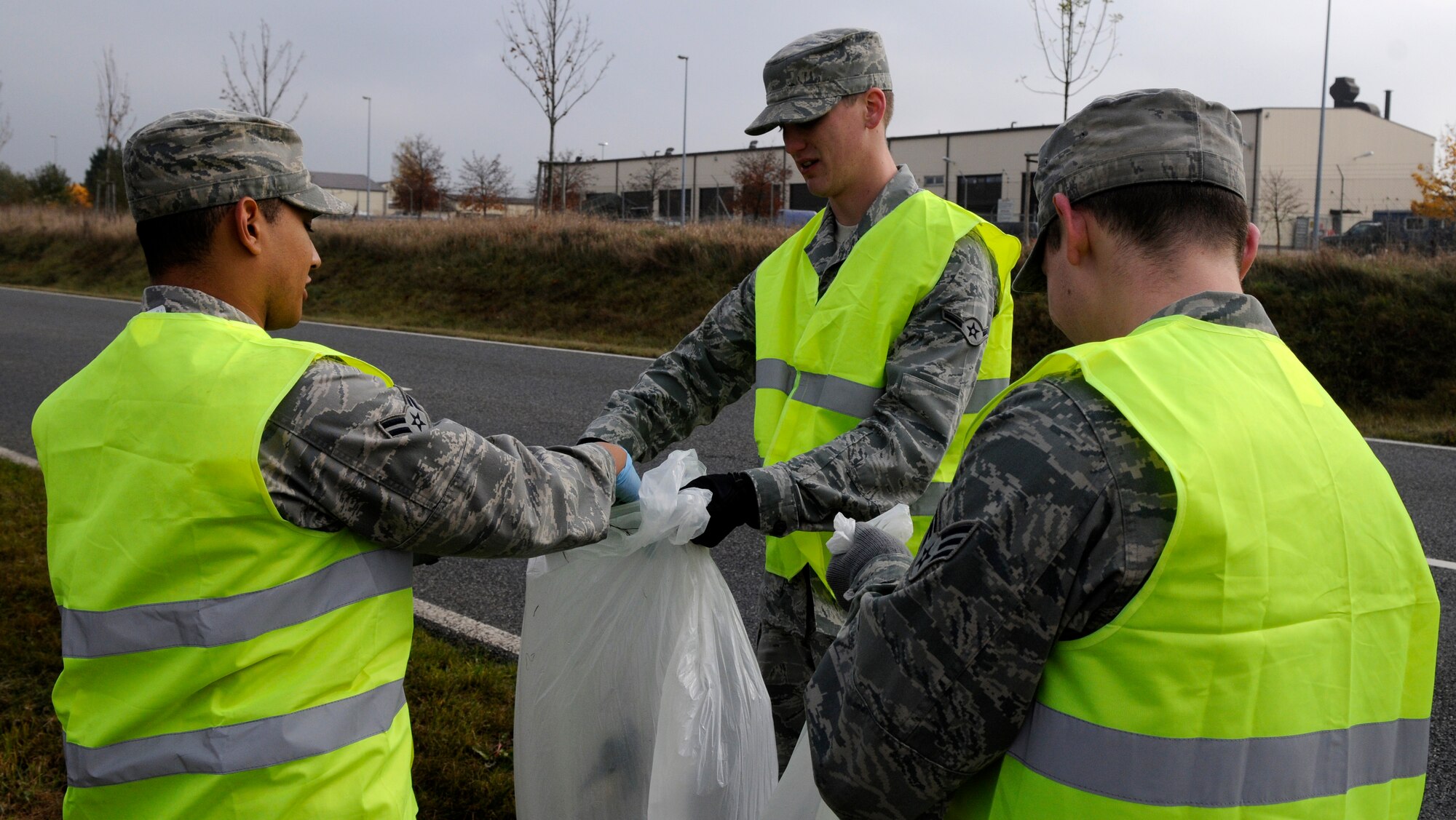 SPANGDAHLEM AIR BASE, Germany – Airmen from the 52nd Component Maintenance Squadron Avionics Flight, work together to collect trash and other debris along the L-46 near the base Oct. 30. The event was organized by the Eifel Riders, a motorcycle mentorship club dedicated to rider camaraderie and safety. About 80 participates split into groups and walked along the L-46, A-60 and B-50 collecting 110 bags of trash that filled two and a half dumpsters. (U.S. Air Force photo/Airman 1st Class Staci Miller)