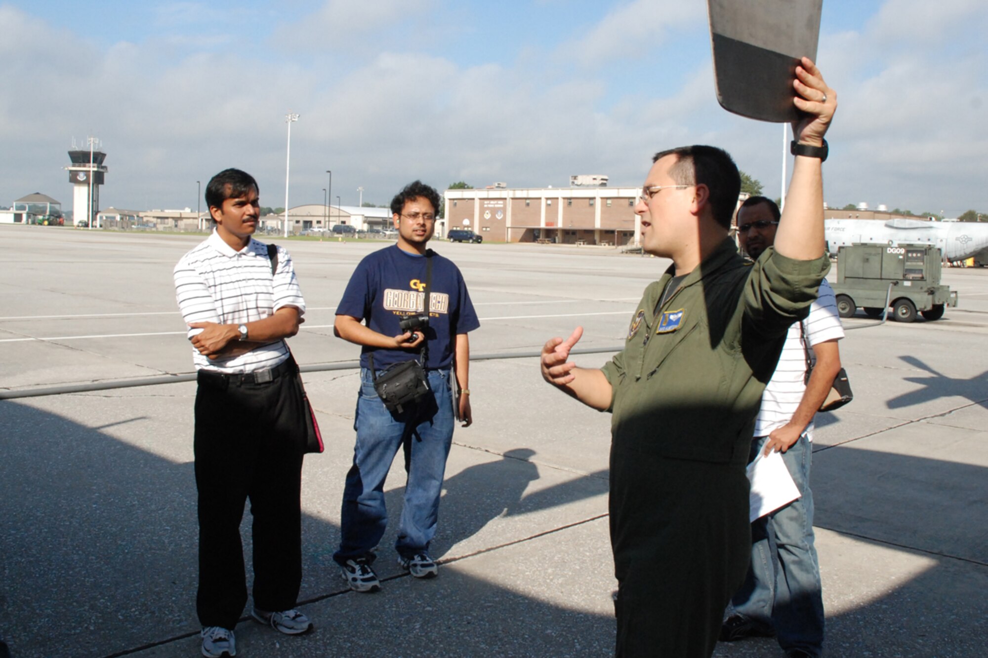 Capt. Charles D. Albertson, pilot, 700th Airlift Squadron, showcases componants of a C-130H aircraft to members of the Georgia Tech University Flying Club and the Marcus Jewish Community Center of Atlanta during a base tour Oct. 9. (U.S. Air Force photo/Tech. Sgt. James Branch)