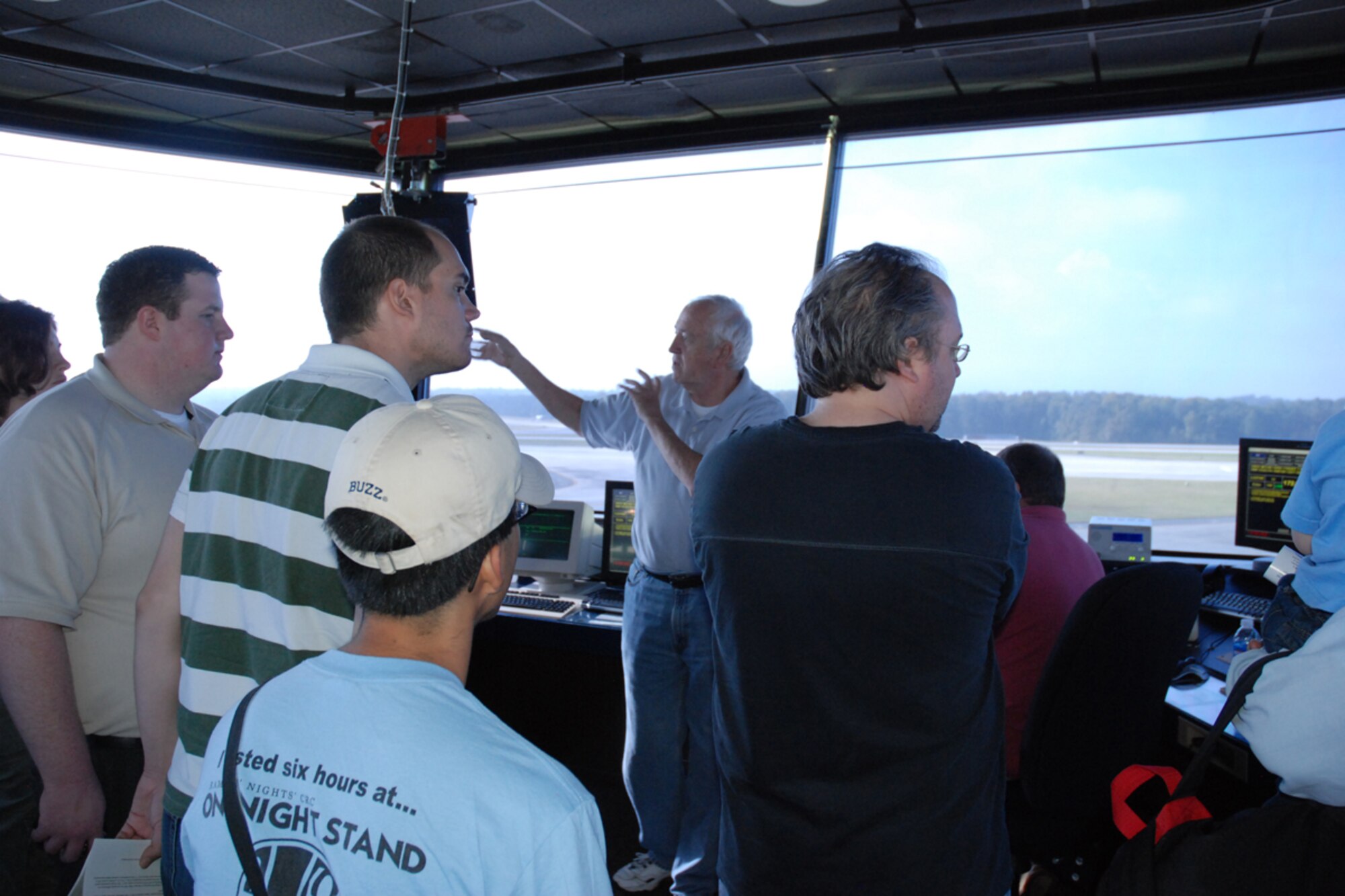Jim Ireland, air traffic controller, 94th Operations Group deomstrates daily control tower operations to members of the Georgia Tech University Flying Club and the Marcus Jewish Community Center of Atlanta during a base tour Oct. 9. (U.S. Air Force photo/Tech. Sgt. James Branch)