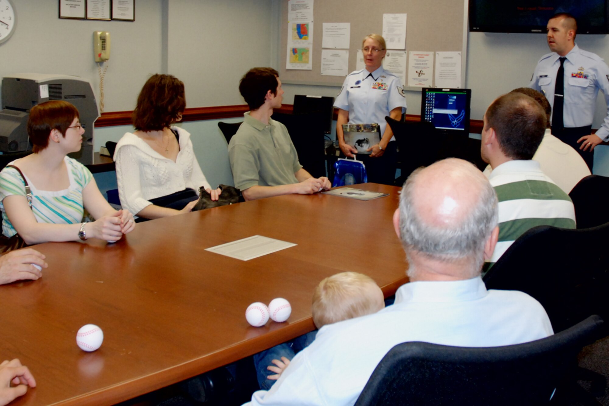 Tech. Sgt. Kimberly C. McBride and TSgt Joshua T. Gray of the 94th Recruiting Squadron explain opportuninties in the Air Force Reserve to members of the Georgia Tech University Flying Club during a base tour Oct. 9. (U.S. Air Force photo/Tech. Sgt. James Branch)