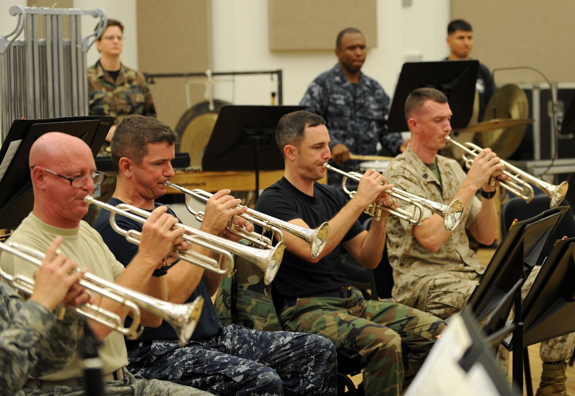 LANGLEY AIR FORCE BASE, Va. – The trumpet section of a combined force military band practices during a rehearsal here Oct. 29 in preparation for the 14th Annual "Salute to Veterans" concert, hosted by U.S. Joint Forces Command.  The concert is scheduled for Friday, Nov. 6, at the Chrysler Hall in Norfolk and is free and open to the public.  (U.S. Air Force photo/Airman Rebecca Montez)