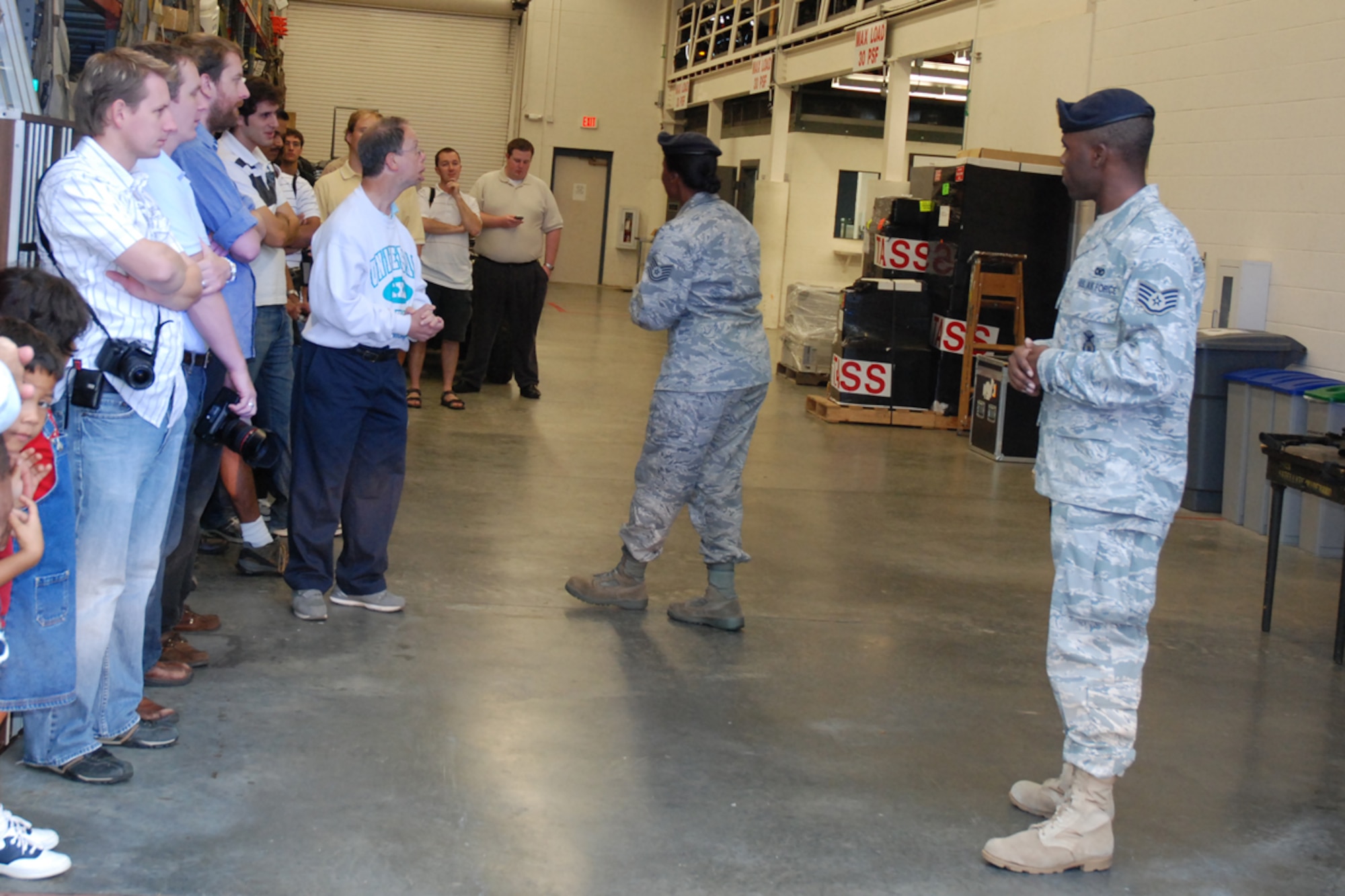 Tech Sgt. Doreen Blake and Staff Sgt. Aaron Doss of the 94th Security Forces Squadron demonstrate fire team procedures to members of the Georgia Tech University Flying Club and the Marcus Jewish Community Center of Atlanta during a base tour Oct. 9. (U.S. Air Force photo/Tech. Sgt. James Branch)
