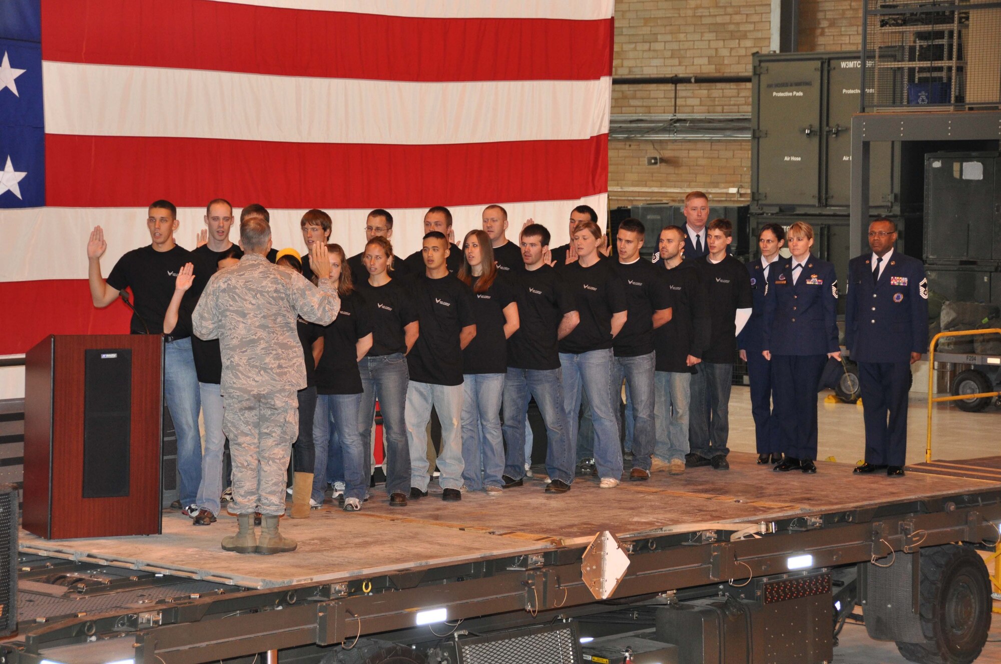 Twenty new recruits take the oath of enlistment from Col. Tim Tarchick, 934th Airlift Wing commander, at the Oct. 4 Commander?s Call. Most will return to the 934th after completing basic training and technical school. (Air Force Photo/Tech. Sgt. Bob Sommer)