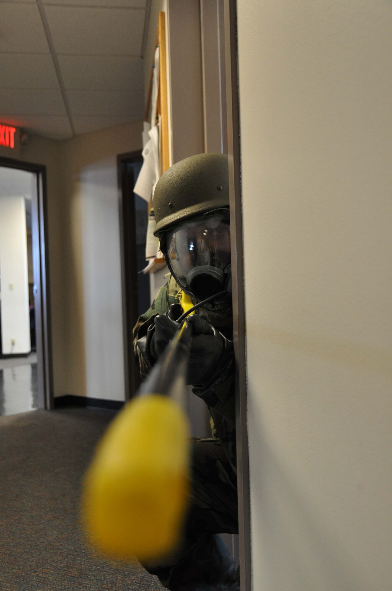 Left, Staff Sgt. Tagisiaalii Faumuina, 96th Airlift Squadron, defends his building with a simulated weapon during an Ability to Survive and Operate exercise Oct. 4. (Air Force Photo/Tech. Sgt. Bob Sommer)