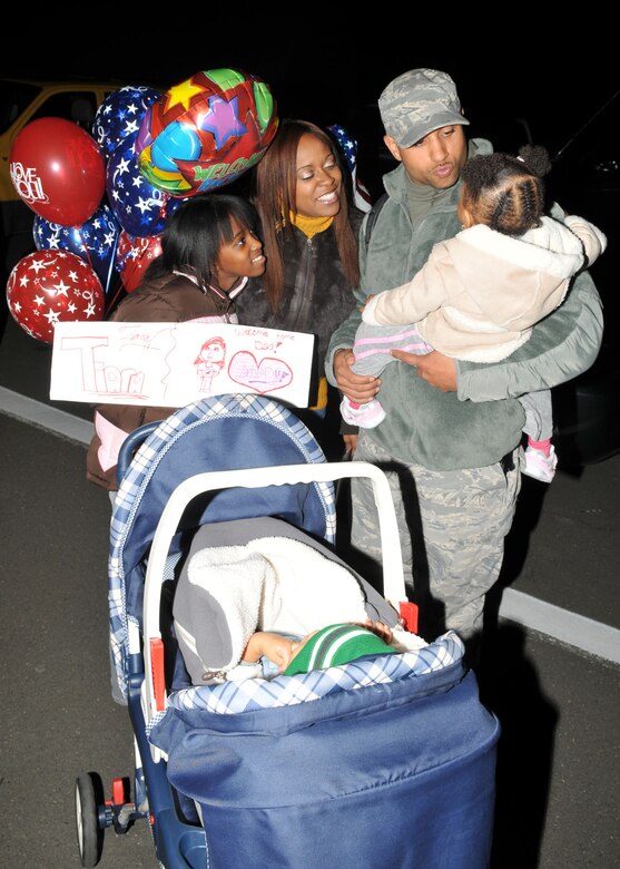SPANGDAHLEM AIR BASE, Germany -- Airman 1st Class Frederick Hough, 52nd Security Forces Squadron, plays with his 2-year-old son, Sean, after returning from a deployment to Bagram Airfield, Afganistan, Oct. 27. Airman Hough returned from a six-month deployment in support of Operation Enduring Freedom. (U.S. Air Force photo/Airman 1st Class Nick Wilson)