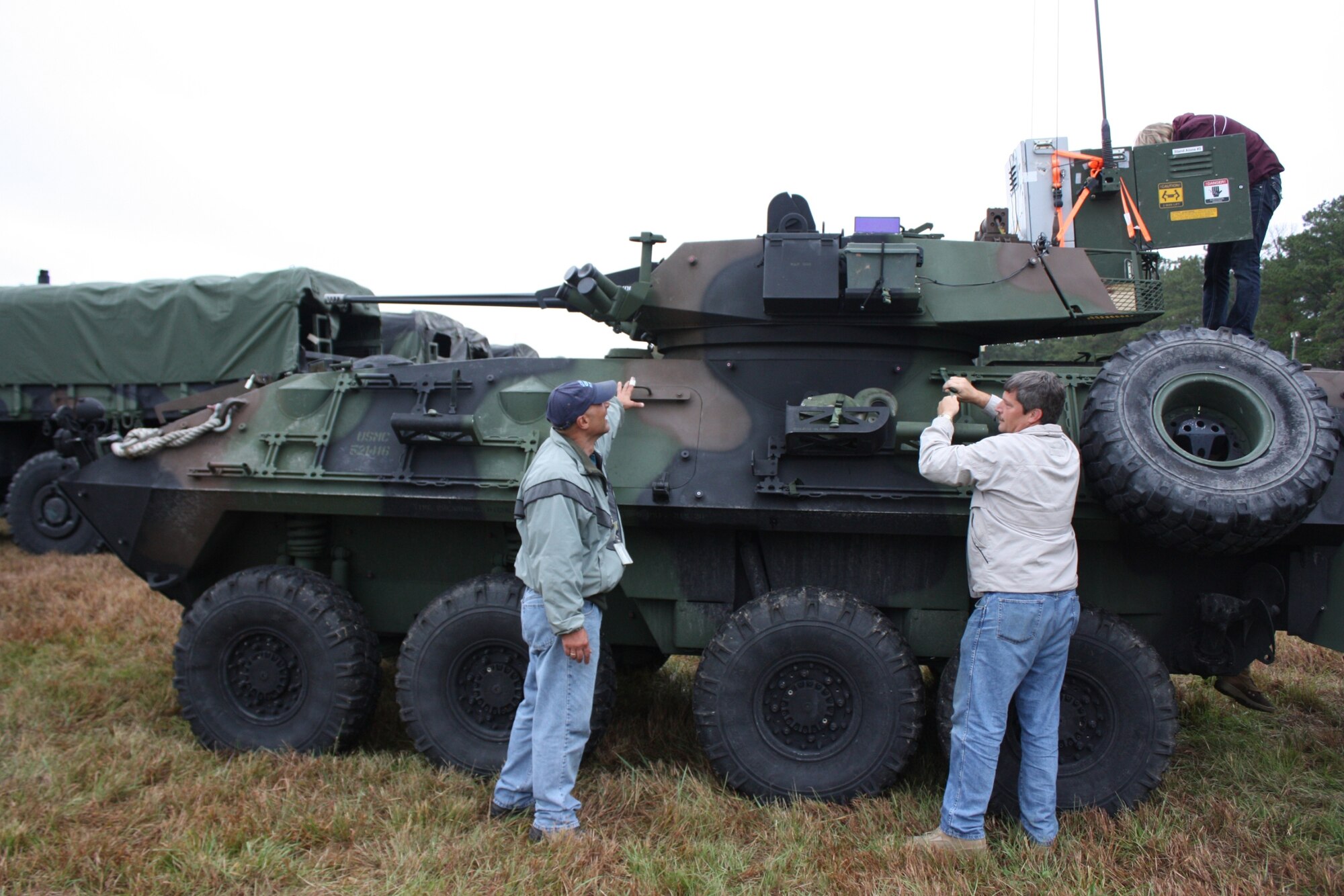 JFIIT communication experts check equipment on a U.S. Marine Corps Light Armored Vehicle (LAV) prior to the start of the Bold Quest Coalition Combat Identification (CCID) Advanced Concept Technology Demonstration (ACTD) at Camp Lejeune, N.C.  (Casey Bain, JFIIT, USJFCOM)