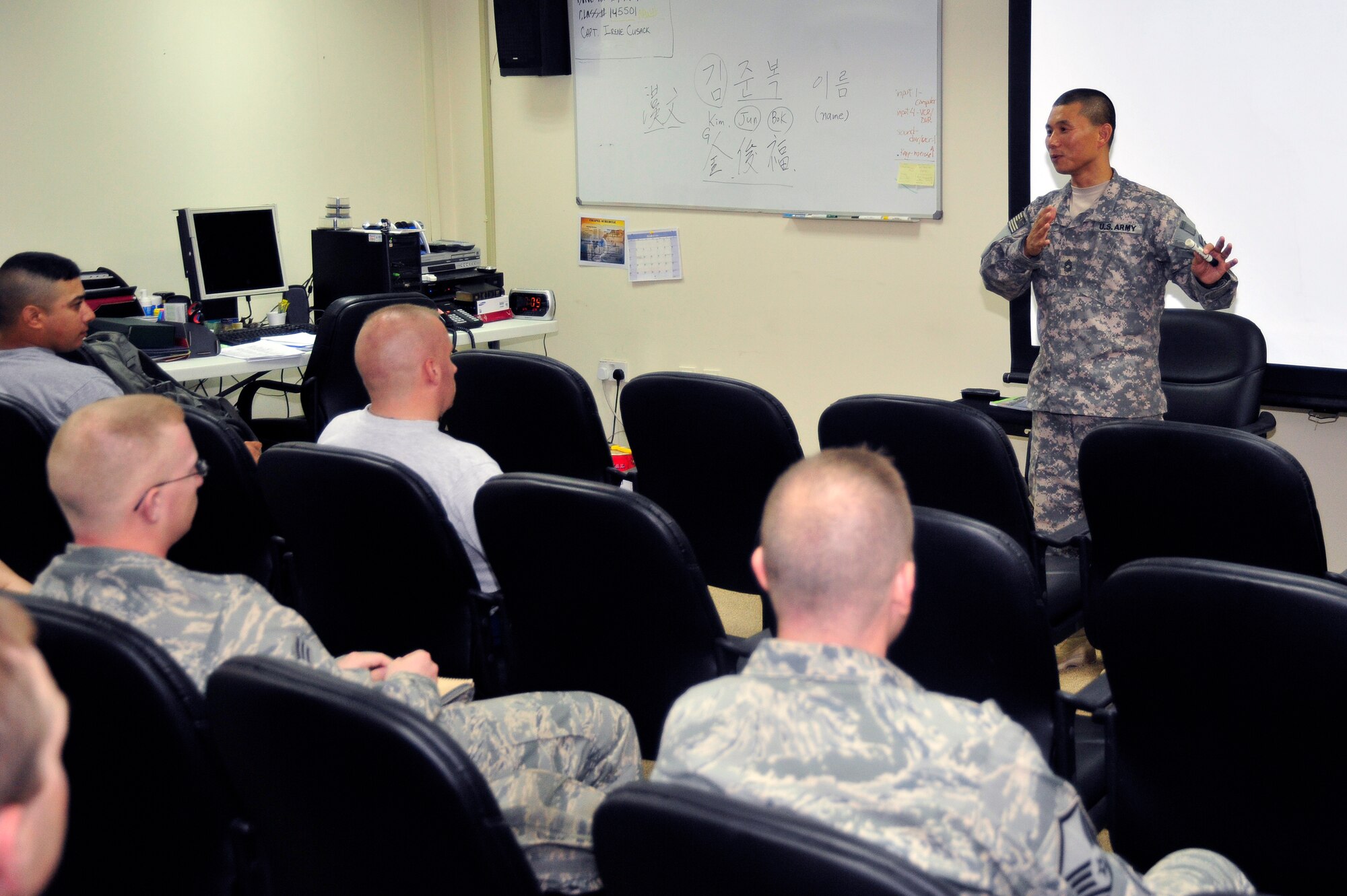 SOUTHWEST ASIA -Master Sgt. Jun Kim, U.S. Army, teaches a classroom of Airmen and Soldiers the Korean language (Hangul) in the base chapel Oct. 29, 2009. Sergeant Kim teaches Hangul every Tuesday and Thursday at 7 p.m. on the second floor of the chapel. (U.S. Air Force photo/Tech. Sgt. Charles Larkin Sr)