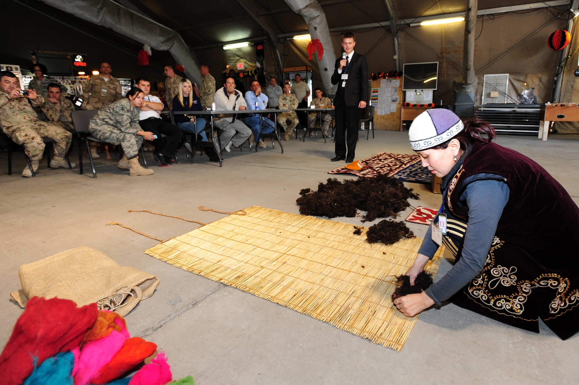 TRANSIT CENTER AT MANAS, Kyrgyzstan -- Traditional Kyrgyz Carpet Expert Fatima Aipova, prepares a carpet from wool during a demonstration at Pete's Place as part of Kyrgyz Culture Day, Oct. 24, 2009. (U.S. Air Force photo/Senior Airman Steele C. G. Britton)
