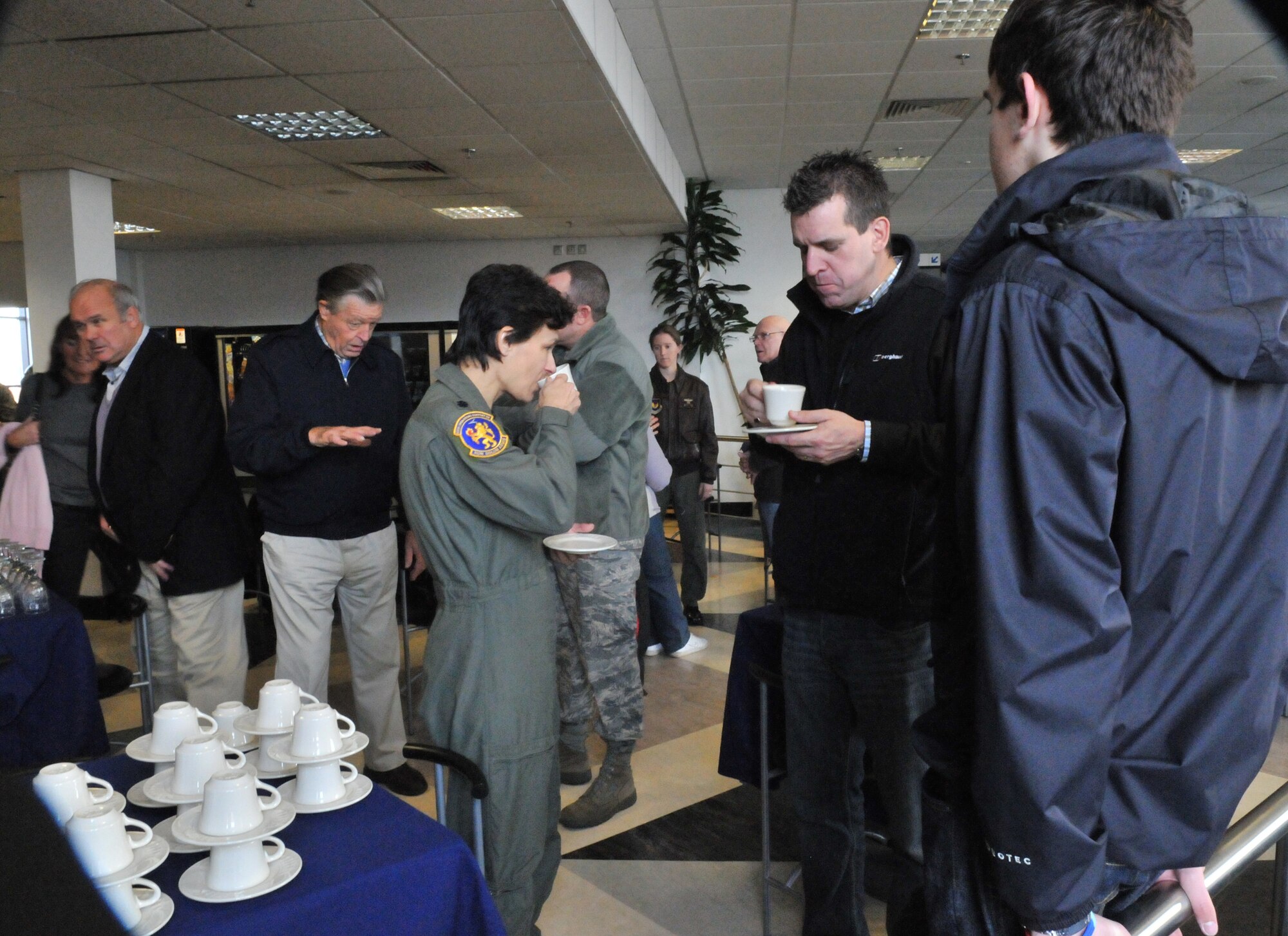 RAF MILDENHALL, England -- Honorary commanders and their distinguished guests enjoy beverages prior to RAF Mildenhall's Honorary Commanders' Deployment Day Oct. 29. After their refreshments, the distinguished guests experienced hands-on mobility training and deployed to a simulated "Camp Kabul, Afghanistan." (U.S. Air Force photo/Tech. Sgt. Kevin Wallace)
