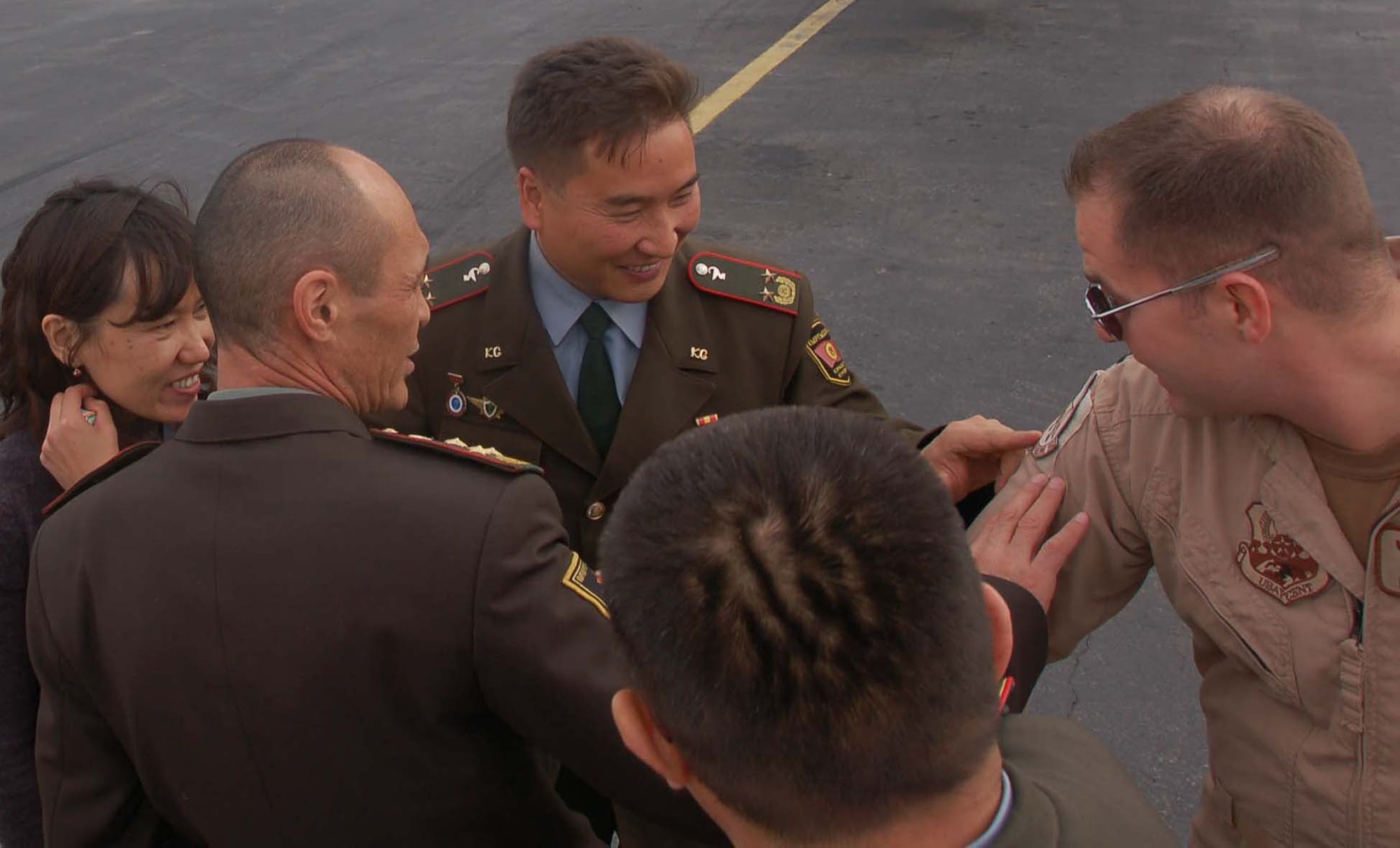 Capt. Nicholas Motlagh, 22nd Expeditionary Air Refueling Squadron, explains the difference between an Air Force squadron patch and a wing patch to a Kyrgyz Ministry of Defense medical team during a visit to the Transit Center at Manas Oct. 27.  The visit was part of the partnership between Airmen at the Transit Center and Kyrgyz Ministry of Defense medical team.  During the visit, the team also shared ideas and gained insight from Airmen on how to properly equip their newly built hospital.  (U.S. Air Force photo/Staff Sgt. Olufemi Owolabi) 