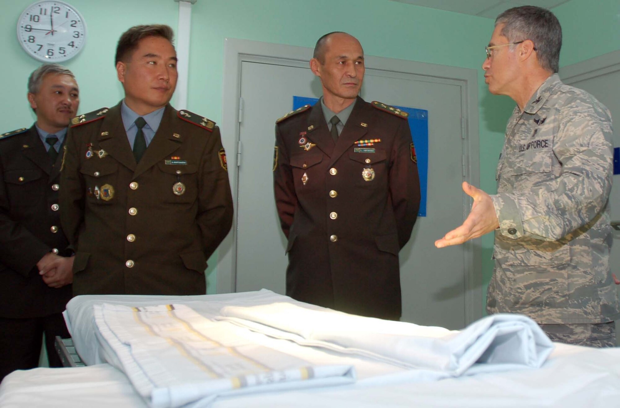 Col. Jerrold Flyer, 376th Expeditionary Medical Group commander, shows a team of Kyrgyz medical doctors the Manas operating room during the team’s visit to the Transit Center at Manas Oct. 27.  During the visit, Colonel Abykeev and his team learned about the Air Force mission and gained insight from Airmen on how to properly equip their newly built hospital.  (U.S. Air Force photo/Staff Sgt. Olufemi Owolabi)