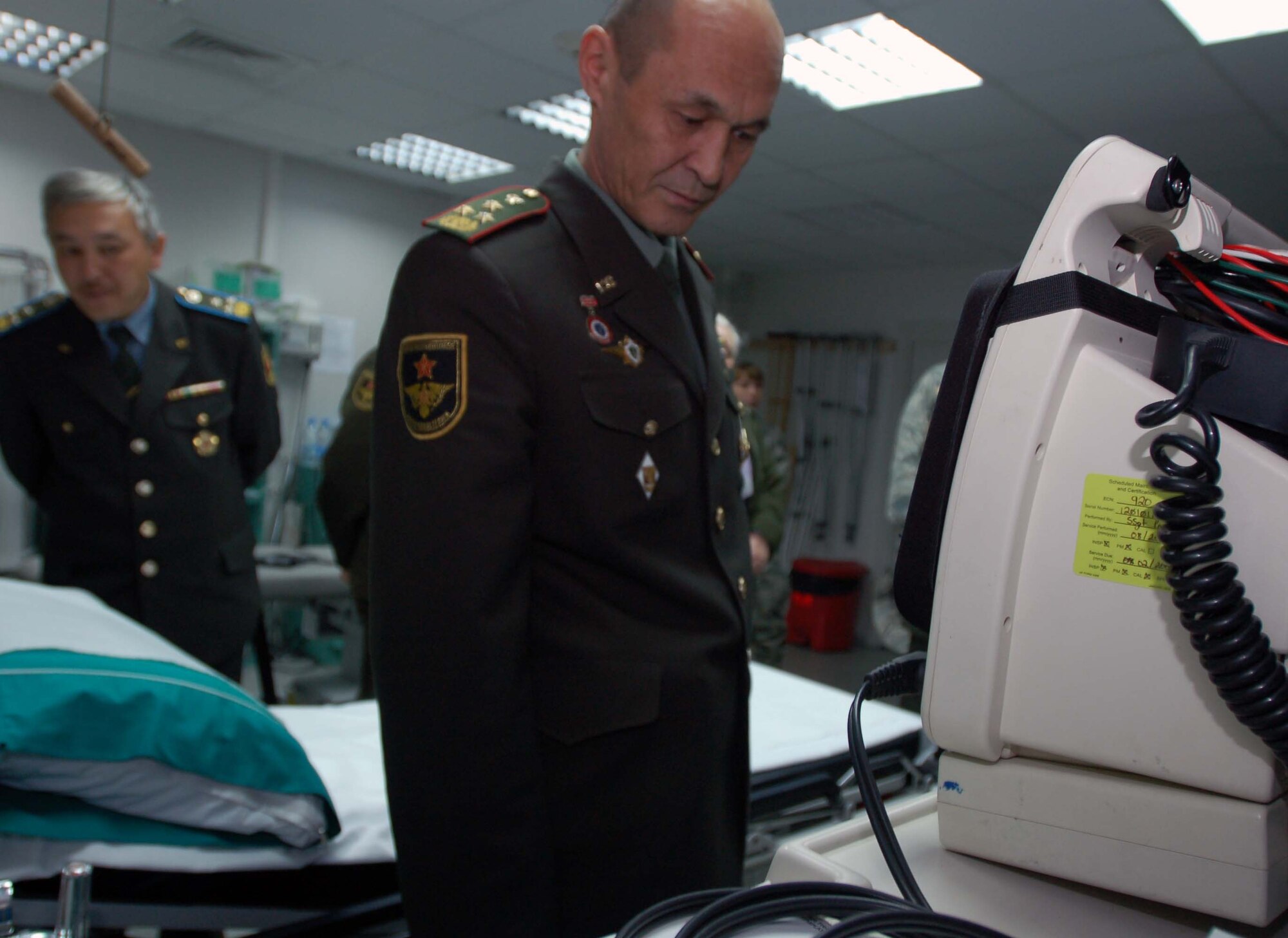 Col. Iskender Abykeev, head of military medical department at the Kyrgyz Ministry of Defense, checks out medical equipment at the 376th Expeditionary Medical Group’s surgery room during a visit to the Transit Center at Manas Oct. 27.  During the visit, Colonel Abykeev and his team of medics learned about the Air Force mission and gained insight from Airmen on how to properly equip their newly built hospital.  The visit was part of the partnership between Airmen at the Transit Center and Kyrgyz Ministry of Defense medical team.  (U.S. Air Force photo/Staff Sgt. Olufemi Owolabi) 
