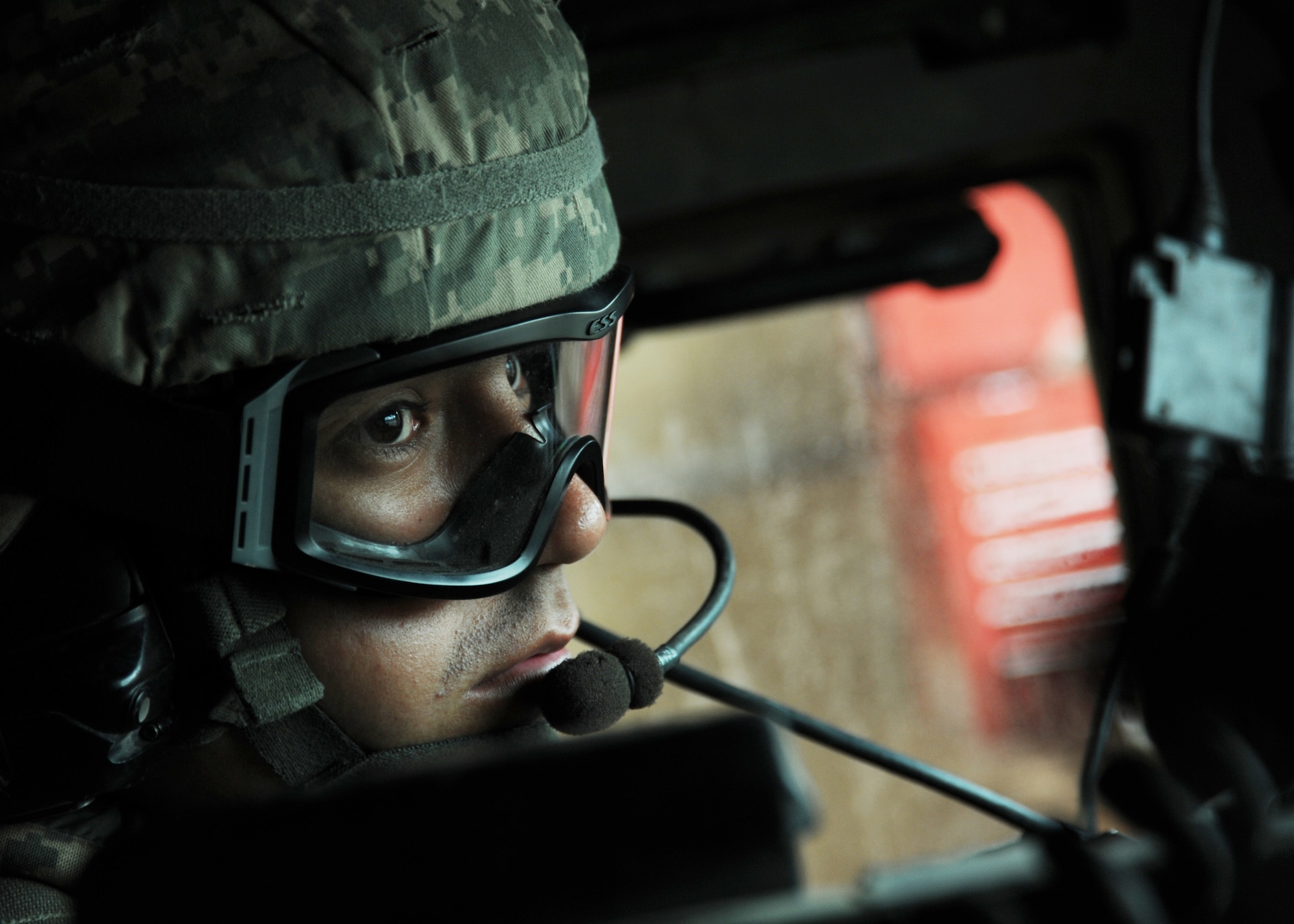 JOINT BASE BALAD, Iraq -- Senior Airman Steve Forlong, 532nd Expeditionary Security Forces Squadron desk controller, waits in the driver’s seat of a humvee to conduct a patrol mission outside the wire Oct. 29, 2009. Airman Forlong is a member of the internal response force, which conducts patrols around the immediate vicinity of JBB. (U.S. Air Force photo/Senior Airman Christopher Hubenthal)