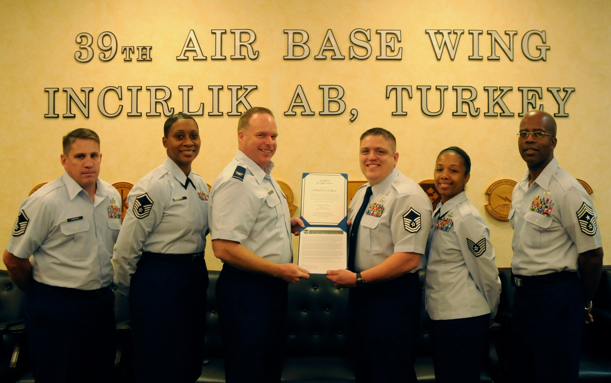 Col. Eric Beene, 39th Air Base wing commander, accepts his certificate from Master Sgt. Jeffrey Hartman, Incirlik's Air Force Sergeant's Association chapter 1660 president, Monday, Oct. 19, 2009 at Incirlik Air Base, Turkey.  Colonel Beene became an associate member of AFSA to show his support for enlisted Airmen on base.  AFSA is a federally chartered, non-profit organization representing the professional and personal interests of active-duty and retired enlisted members of the U.S. Air Force. (U.S. Air Force photo/Airman 1st Class Amber Ashcraft)