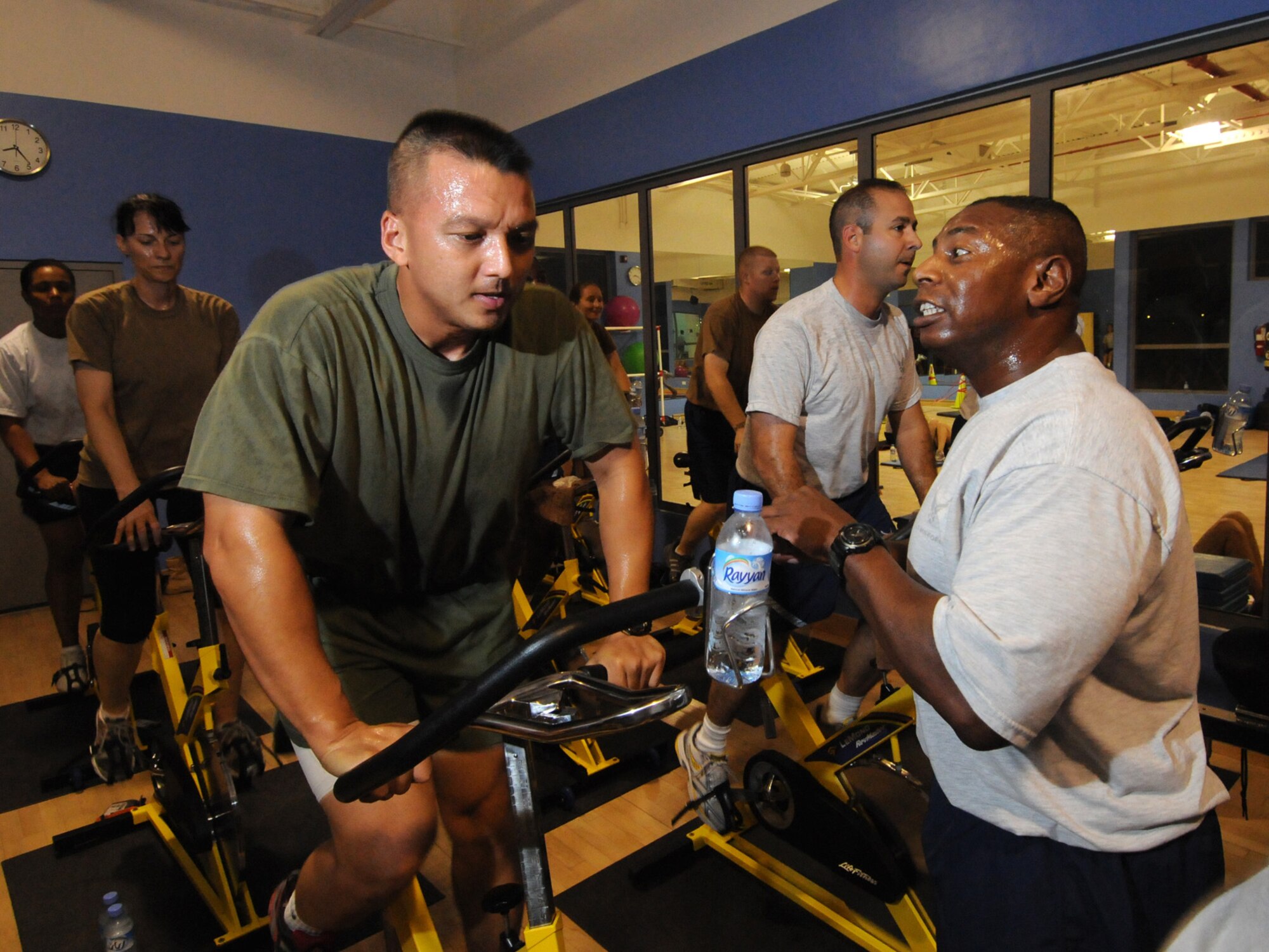 Chief Master Sgt. Lorenzo Anastasie,  379th Expeditionary Operations Group superintendent, motivates students in a spinning class in Southwest Asia, Oct. 29, 2009. Chief Anastasie offers his class, which has more than tripled in participation throughout the past six months, to deployed servicemembers three days a week. Chief Anastasie is deployed from Robins Air Force Base, Ga. in support of operations Iraqi Freedom and Enduring Freedom.
(U.S. Air Force Photo/Tech. Sgt. Jason W. Edwards)