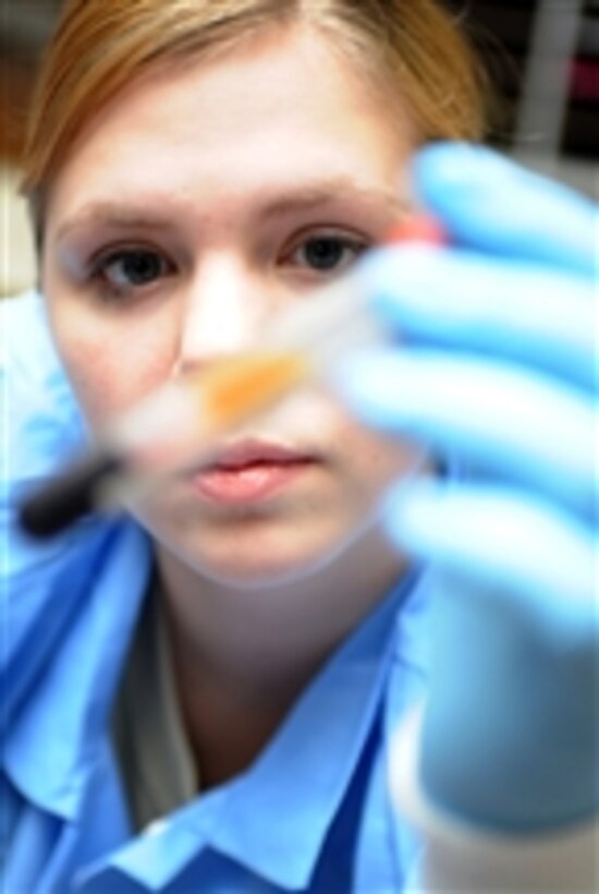 U.S. Air Force Airman 1st Class Amber App, a 28th Medical Support Squadron laboratory apprentice, verifies patient identifications on blood samples at Ellsworth Air Force Base, S.D., on Oct. 15, 2009.  The blood App verifies will be separated and the remaining blood sent on for further analysis.  
