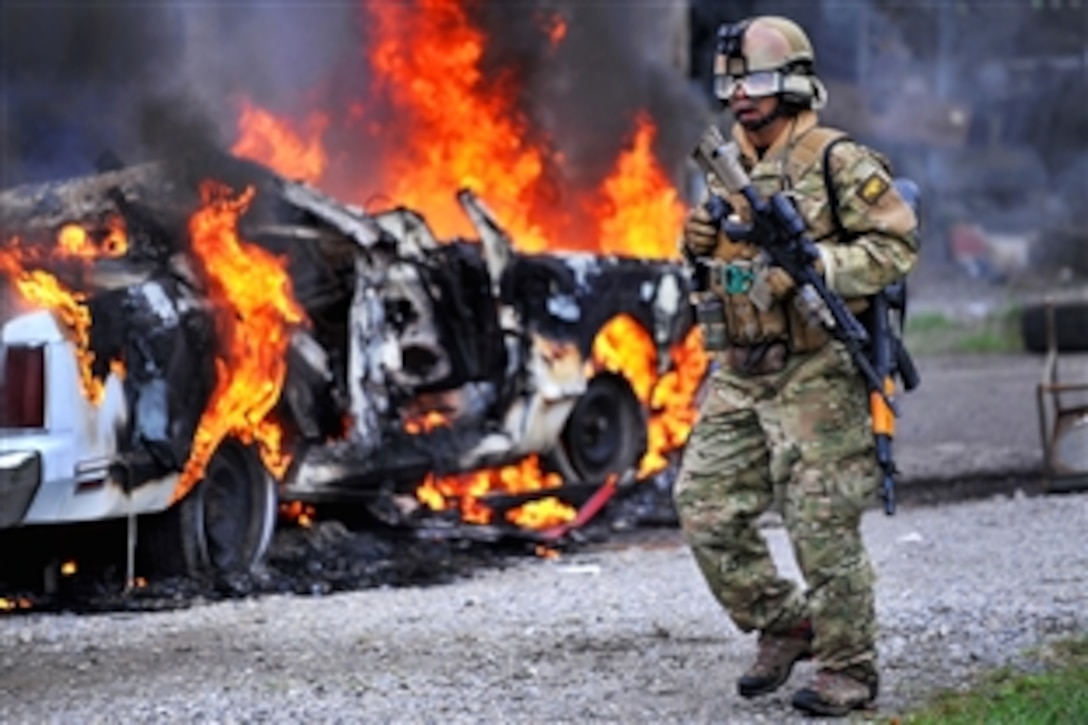 A U.S. Air Force pararescueman surveys his area during a training scenario at an undisclosed U.S. location during exercise Patriot Archangel, Oct. 17, 2009. The exercise hones Guardian Angel combat operations in simulated hostile urban environments and increases combat effectiveness for pararescuemen.