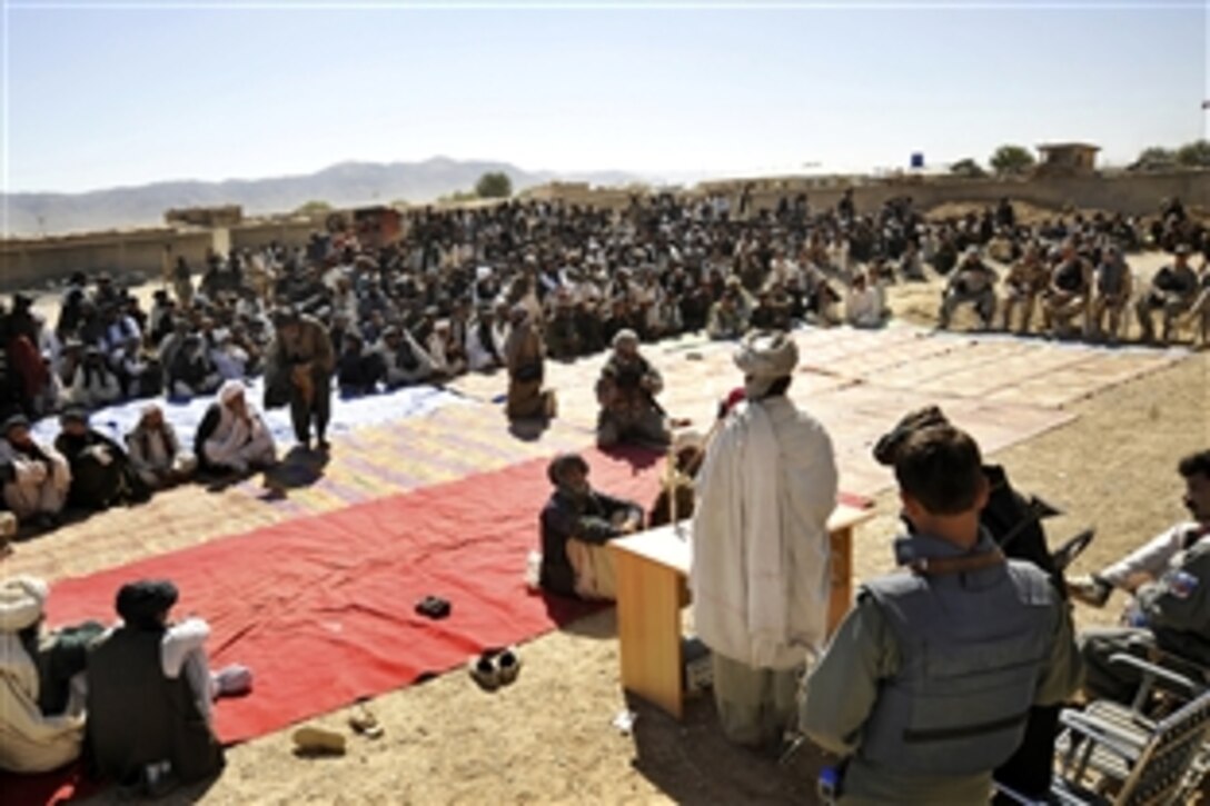 U.S. troops, civilian agencies, Afghan officials and locals attend the groundbreaking ceremony for the first high school for females in the Shajoy region in Zabul province, Afghanistan, Oct. 22, 2009. 