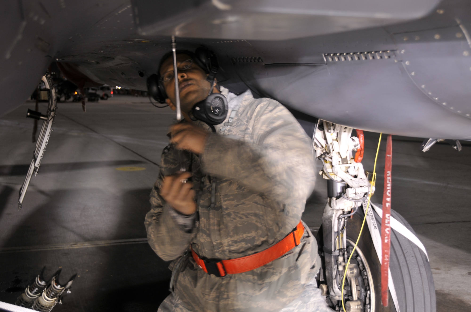 NELLIS AIR FORCE BASE, Nev.--Tech. Sgt. Curtis Walker, an avionics specialist with the 494th Aircraft Maintenance Unit at RAF Lakenheath, England, changes a hardpoint cannon plug on an F-15E Strike Eagle during Red Flag 10-1 at Nellis Air Force Base, Nev., Oct. 30, 2009. Cannon plugs are used to make electrical connections throughout an aircraft. On hardpoints, they provide power for external fuel tanks, targeting pods and munitions racks. The 494th AMU was one of six visiting fighter maintenance units that honed their contingency skills during Red Flag 10-1 between Oct. 19-30. (U.S. Air Force photo/Tech Sgt. Chris Stagner)