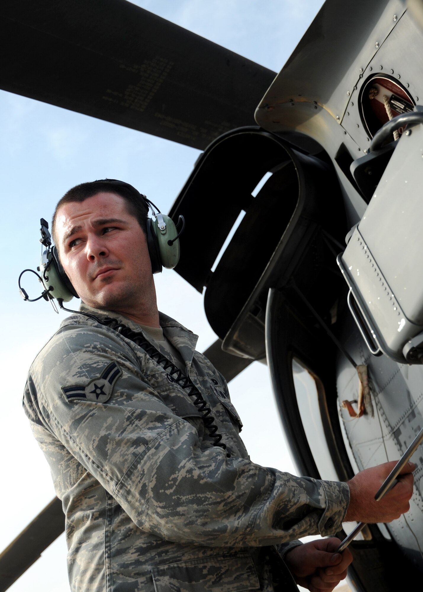 JOINT BASE BALAD, Iraq -- Airman 1st Class Micheal Griggs, 64th Expeditionary Helicopter Maintenance Unit weapons team member, torques a module into place on an HH-60G Pavehawk as part of a maintenance check Oct. 27, 2009. The HH-60G Pave Hawk is maintained by Airmen with various specialties that include communications, navigation, engines, hydraulics, electronics, weapons systems and electronic counter warfare. (U.S. Air Force photo/Senior Airman Christopher Hubenthal)
