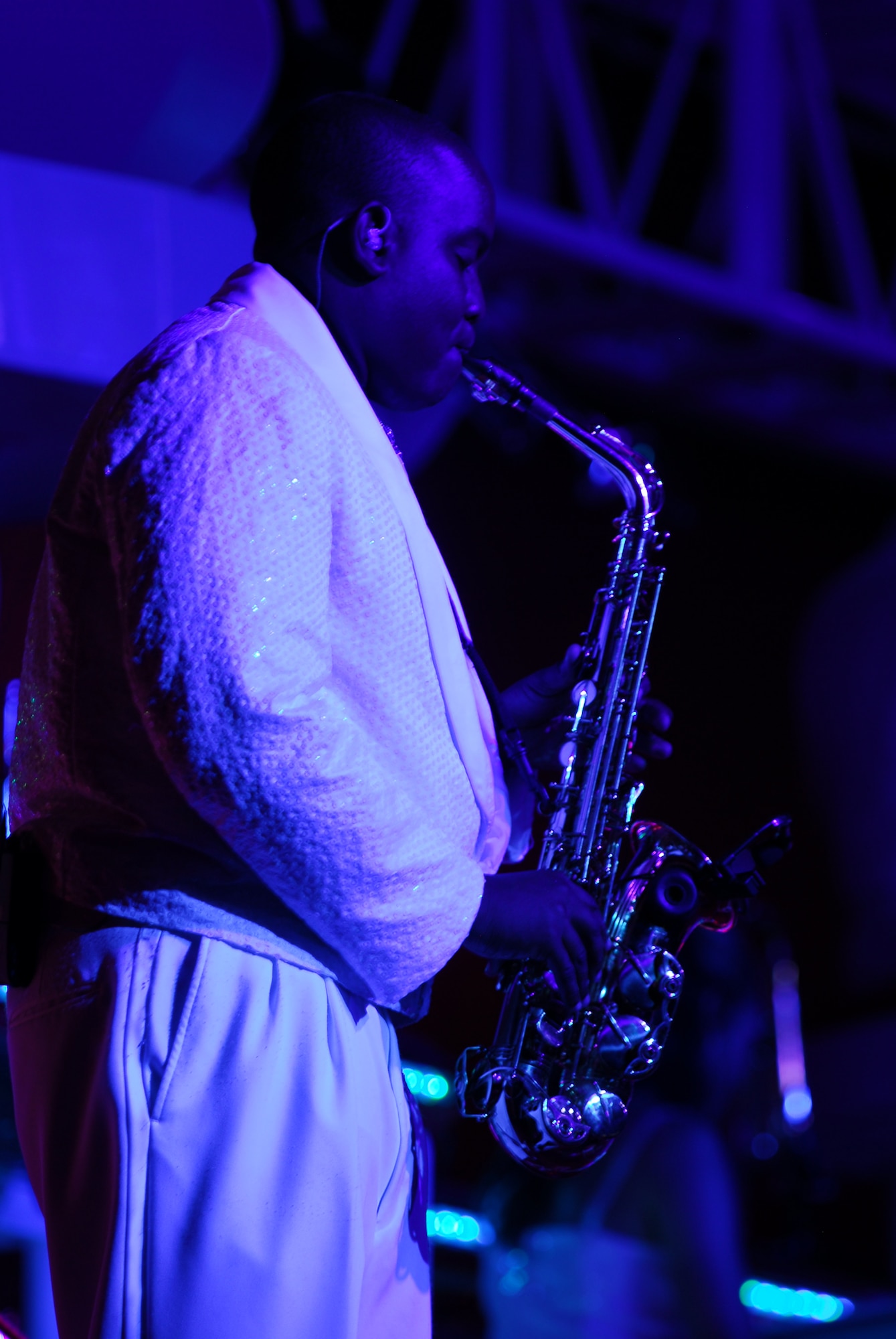 Blowing some cool blues on his alto saxophone during Tops in Blue is Senior Airman Tigh Lewis, 59th Medical Inpatient Squadron, Lackland Air Force Base, Texas. (U.S. Air Force photo by Staff Sgt. Anika Williams)