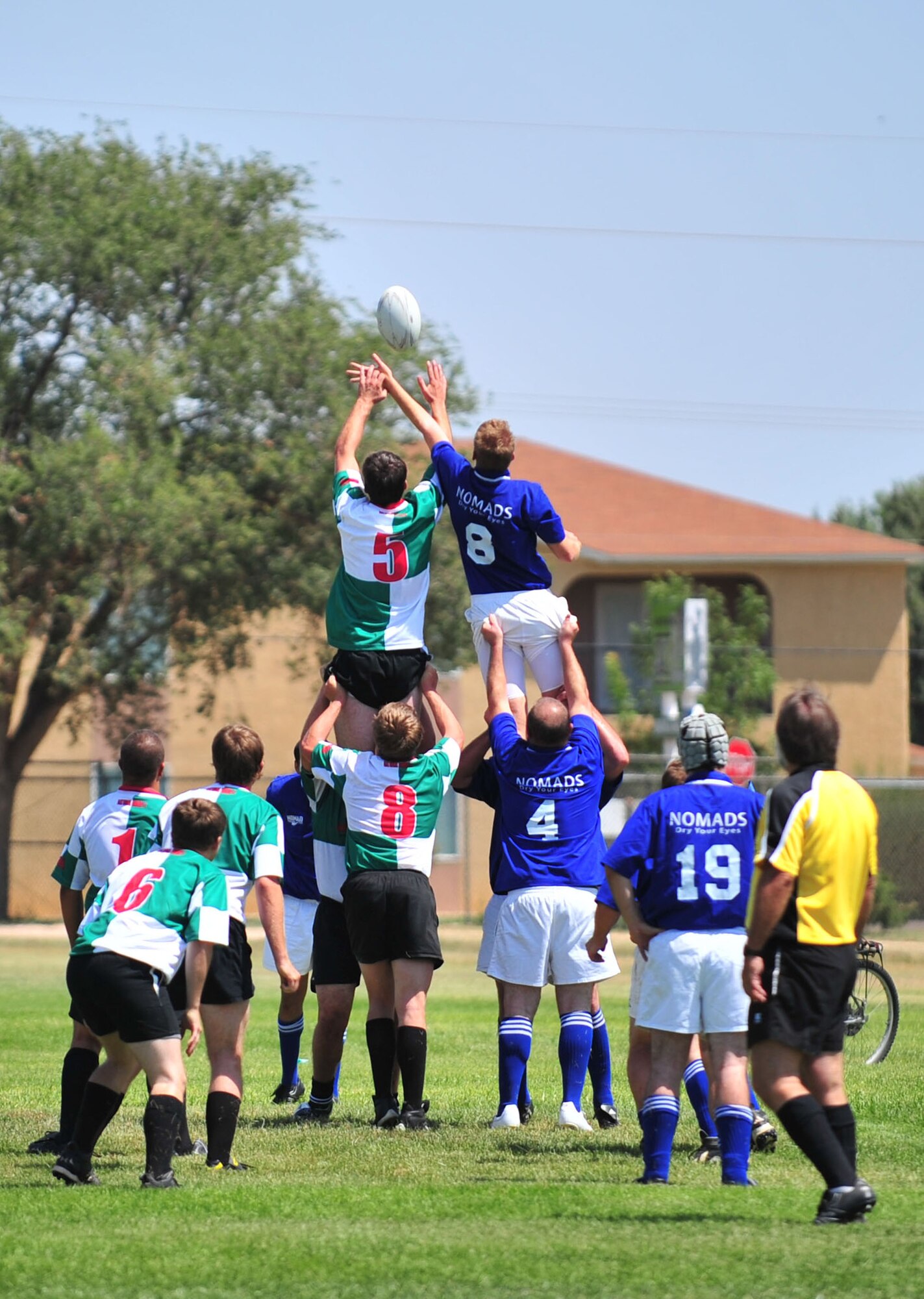 CLOVIS, N.M.--The Las Cruces Chiles (left) and the Clovis Nomads (right) perform a lineout during the Clovis Nomads? first game in Clovis, N.M.  Aug. 29.  A lineout is used to bring the ball back into play after it has been kicked or run out of bounds.  One person on the defense throws the ball into play as each team?s jumpers try to get it.  (U.S. Air Force photo by Staff Sgt. Heather R. Redman/RELEASED)