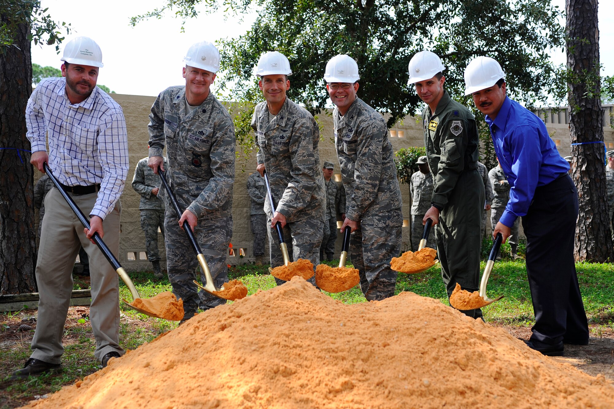 HURLBURT FIELD, FL -- (left) Mr. Tony Luciano, Green-Simmons Company, Inc., Pensacola, FL, Lt. Col. Shawn Moore, 1st Special Operations Civil Engineering Squadron commander, Col. Robert Skinner, 68th Information Operations Wing commander, Lackland Air Force Base, TX, Col. Michael Convertino II, 318th Information Operations Group commander, Lackland AFB, TX, Lt. Col. Dean Clothier, 39th Information Operations Squadron commander, and Mr. Romeo Reyes, 1st Special Operations Contracting Squadron, break ground for the new 39th IOS building, Sep. 1. (U.S. Air Force photo by Senior Airman Julianne Showalter)