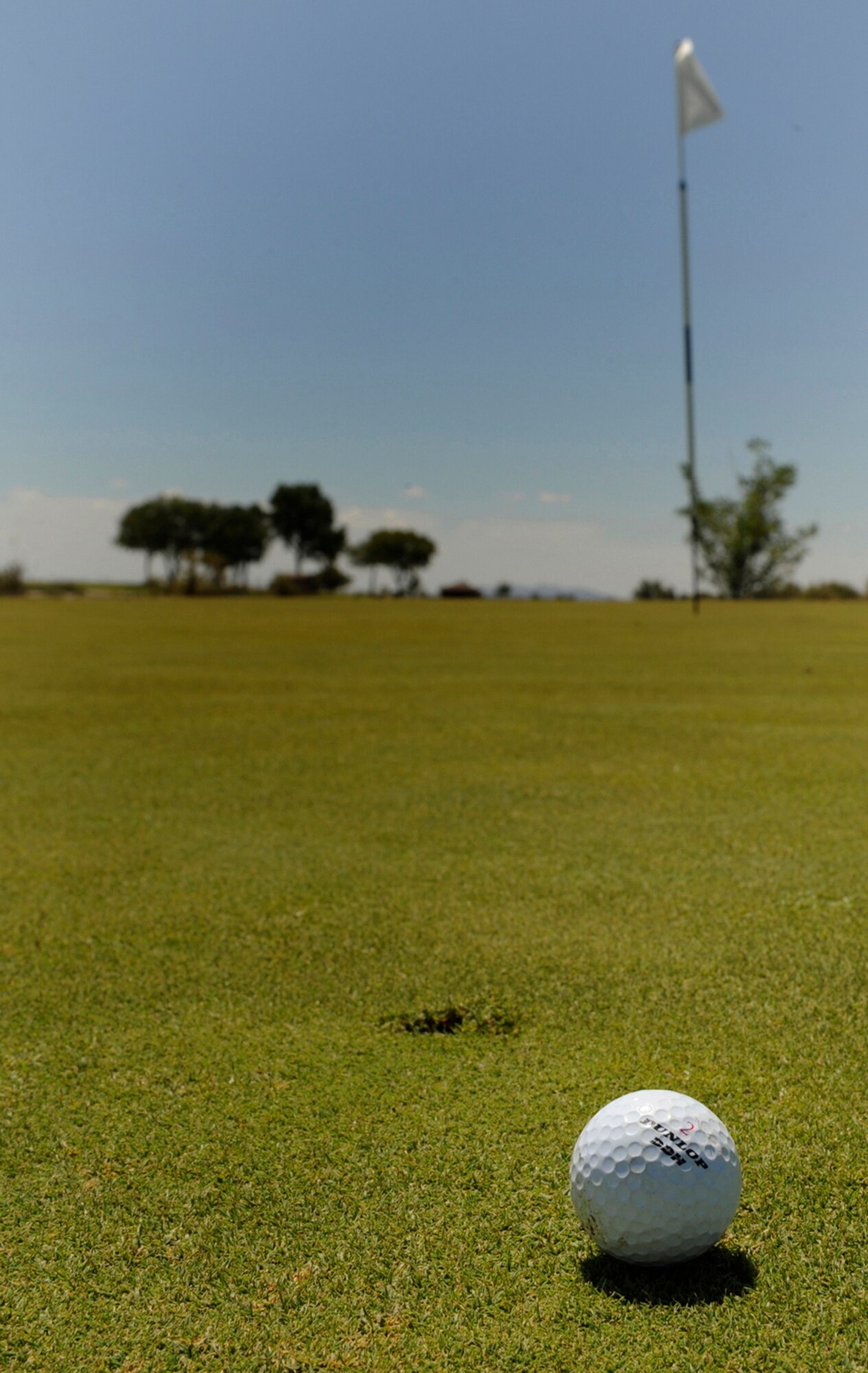 HOLLOMAN AIR FORCE BASE, N.M. -- A golf ball rests yards away from a hole on the Apache Mesa Golf Course here during a fundraising tournament ran by the Chief's Group Aug. 27. The group held the fundraiser to support quality of life initiatives on base. (U.S. Air Force photo by Senior Airman Tiffany Trojca)