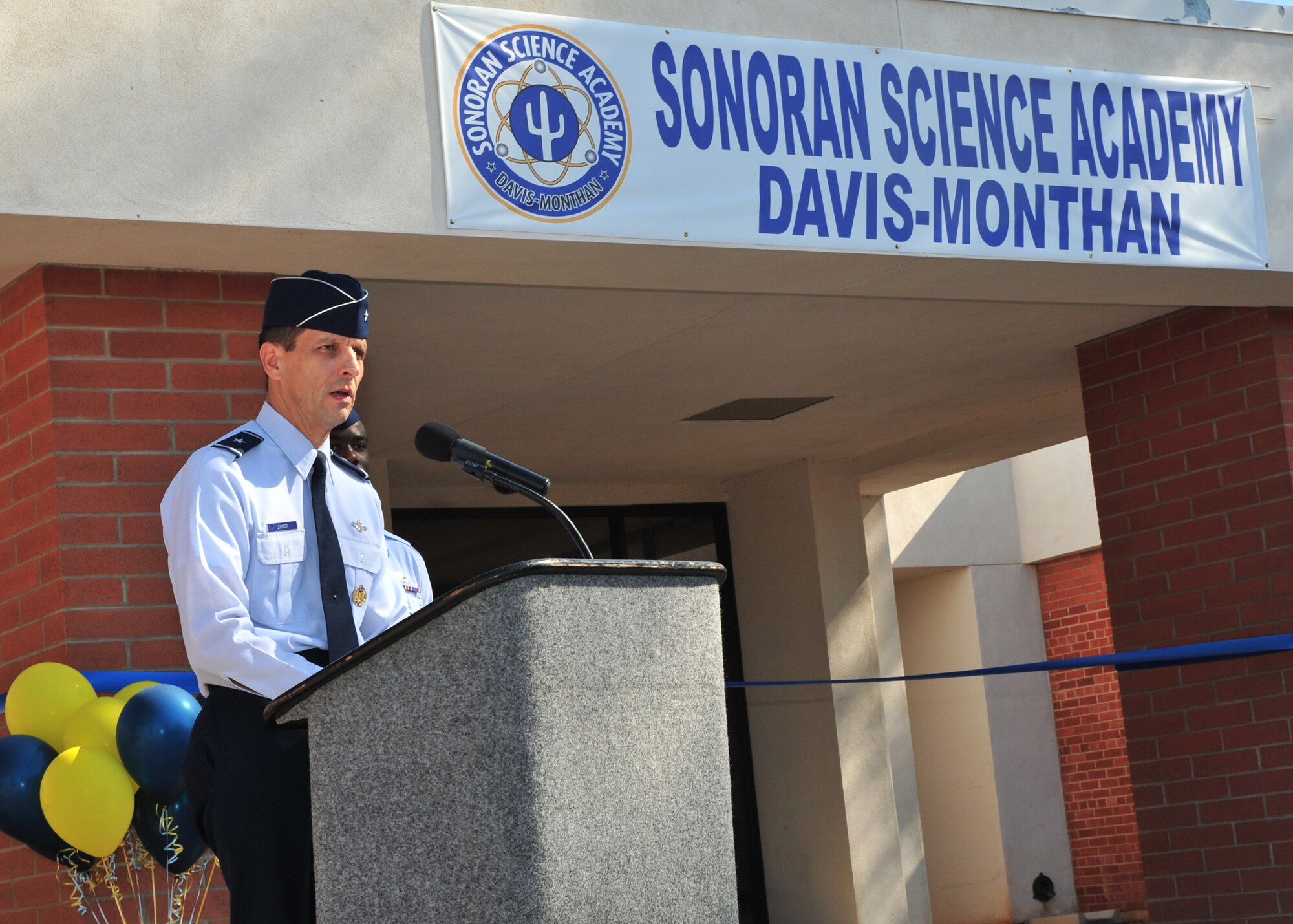 Brig. Gen. Paul T. Johnson, 355th Fighter Wing commander, gives the opening remarks during the ribbon cutting ceremony for the Sonoran Science Academy Middle School here Aug. 26.  The academy is the first ever charter school to open on an Air Force installation. (U.S. Air Force photo by Senior Airman Noah R. Johnson)