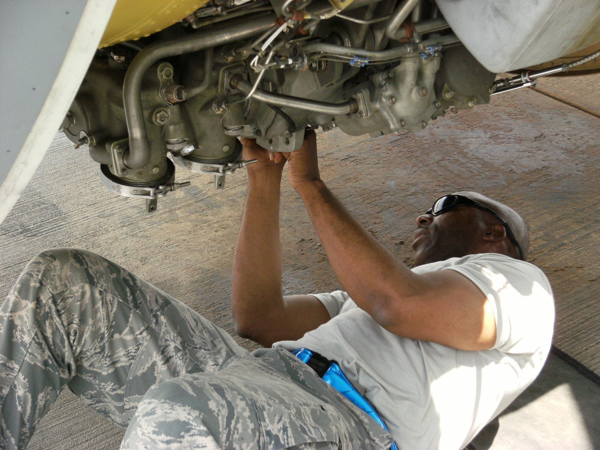 Chief Master Sgt. Antonio Kitt, 340th Expeditionary Aircraft Maintenance Unit, provides maintenance to a KC-135 Stratotanker at a deployed location in Southwest Asia, Aug. 8. Chief Kitt is deployed  to the 340th AMU from McConnell Air Force Base, Kan. (courtesy photo)