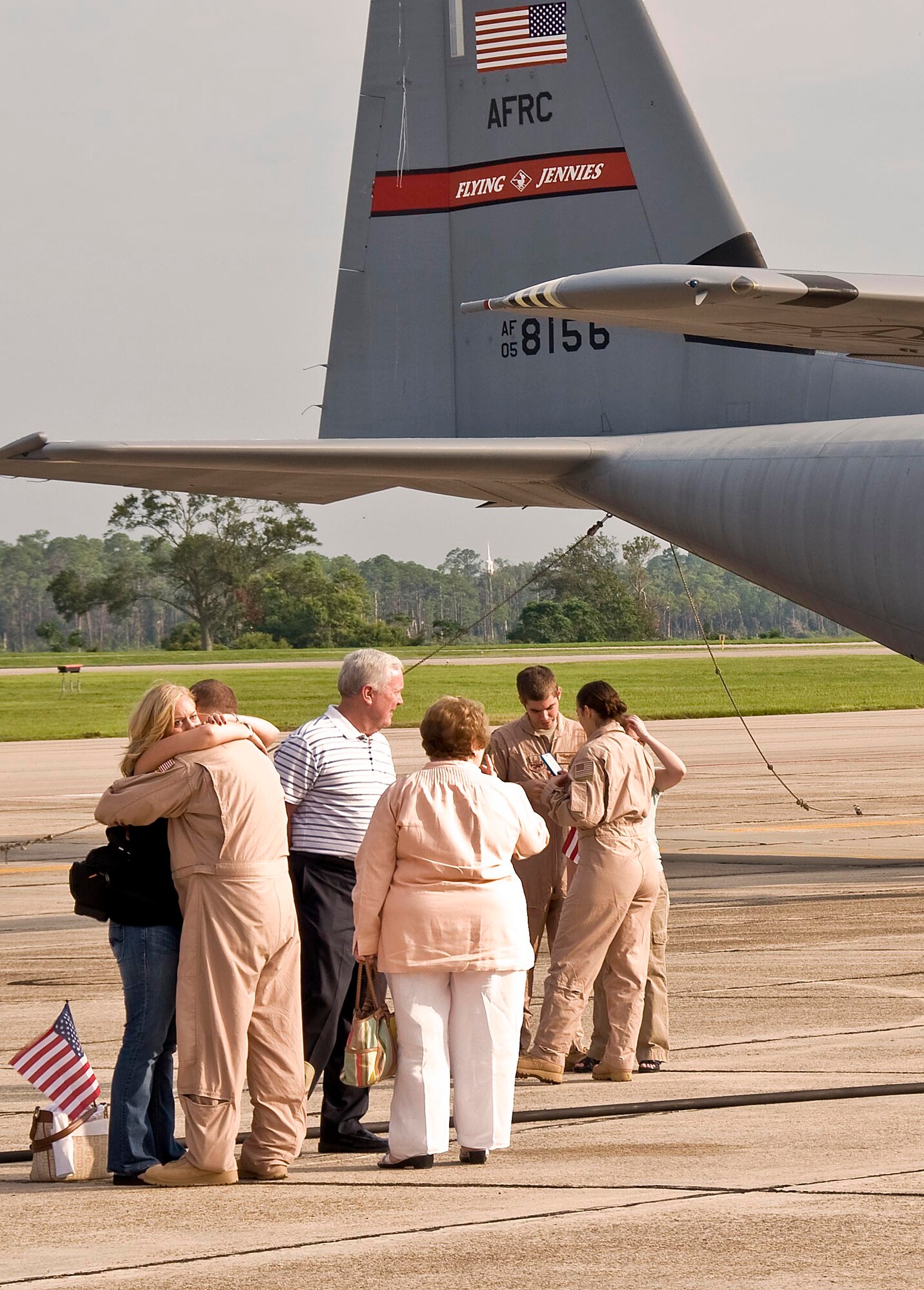 Family members of the 815th Airlift Squadron "Flying Jennies" bid farewell to their loved ones, who departed Keesler Air Force Base, Biloxi, Miss. Aug. 25 for their deployment to Southwest Asia. While these Citizen Airmen are the first members of the 815th AS to depart, others are scheduled to leave in early September. (U.S. Air Force Photo by Staff Sgt. Tanya King)
