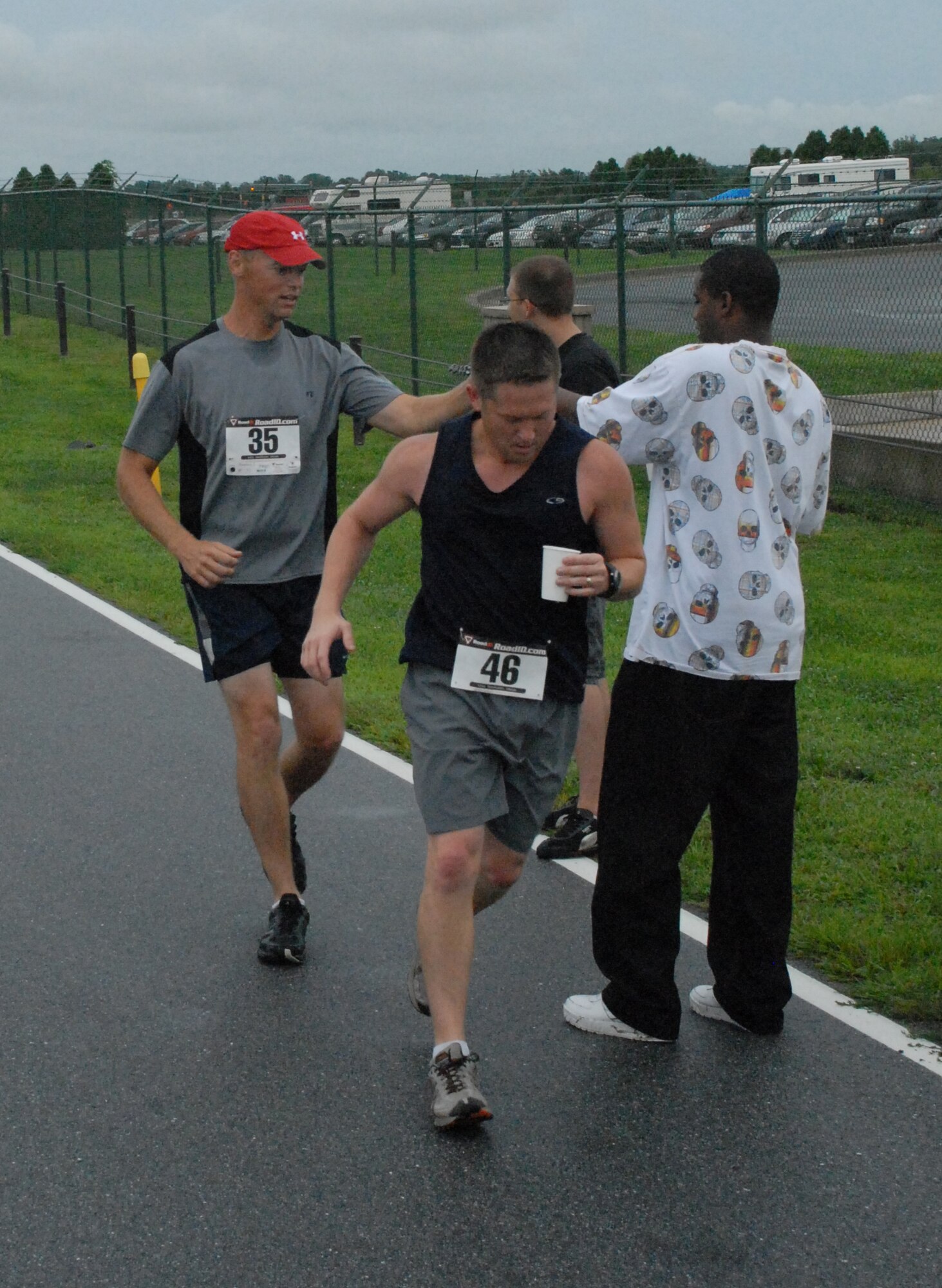 (Front) Jason Gist and Tony Bourdeau participate in the ?Summer Sizzler,? Dover?s first 10-mile run Aug. 29.  A 10-mile run and a 5k fun run was held to prepare Air Force marathon participants for that event.  (U.S. Air Force photo/Staff Sgt. Chad Padgett)  