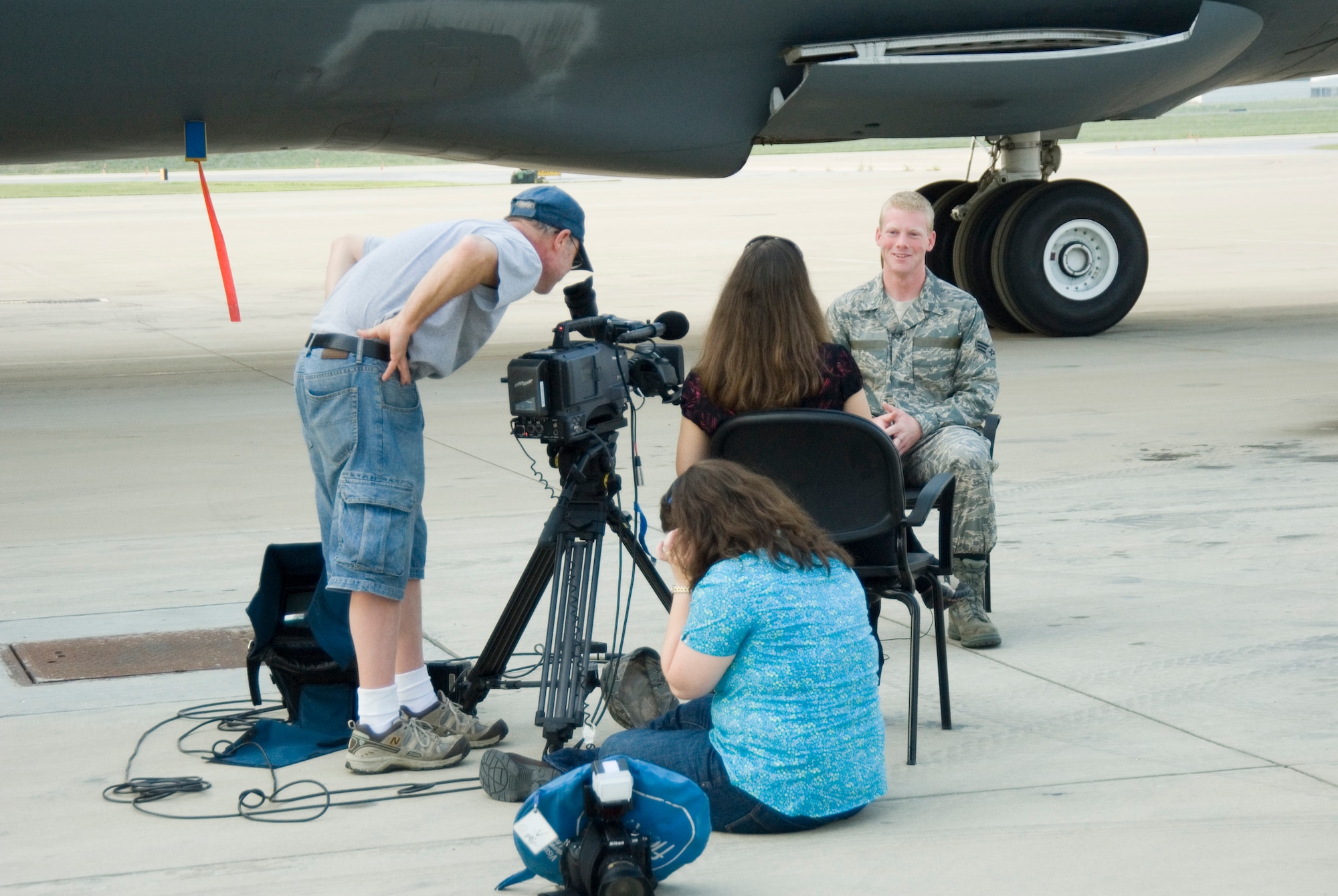 West Virginia University's Television Productions film crew conducts an interview with Senior Airman Nathan Sisler  at the 167th Airlift Wing, Martinsburg, West Virginia, on August 27, 2009. Sisler, a WVU senior and a West Virginia Airman of the Year recipient for 2009, was chosen to be featured in a new recruiting video for WVU because of his leadership qualities according to Kelly Heasley, special projects prouducer for WVU's Television Productions. (U.S. Air Force Photo by Emily Beightol-Deyerle)
