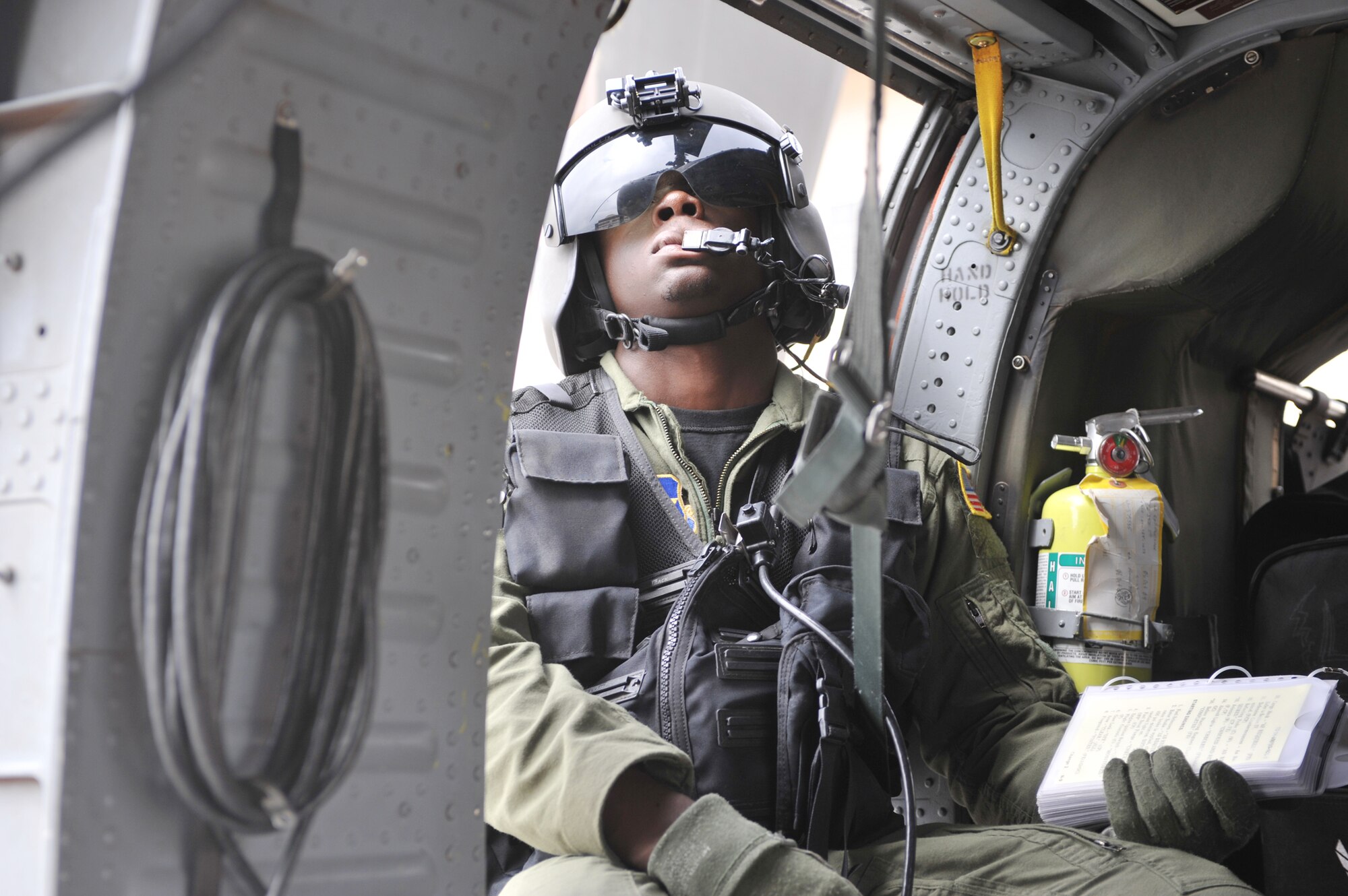 Student gunner Airman 1st Class Sanquez Lee checks the main rotor during engine start up on a HH-60G Pave Hawk Aug. 25, 2009 at Kirtland Air Force Base, N.M.  Airman Lee is assigned to the 58th Training Squadron.   (U.S. Air Force photo/Staff Sgt Quinton Russ)