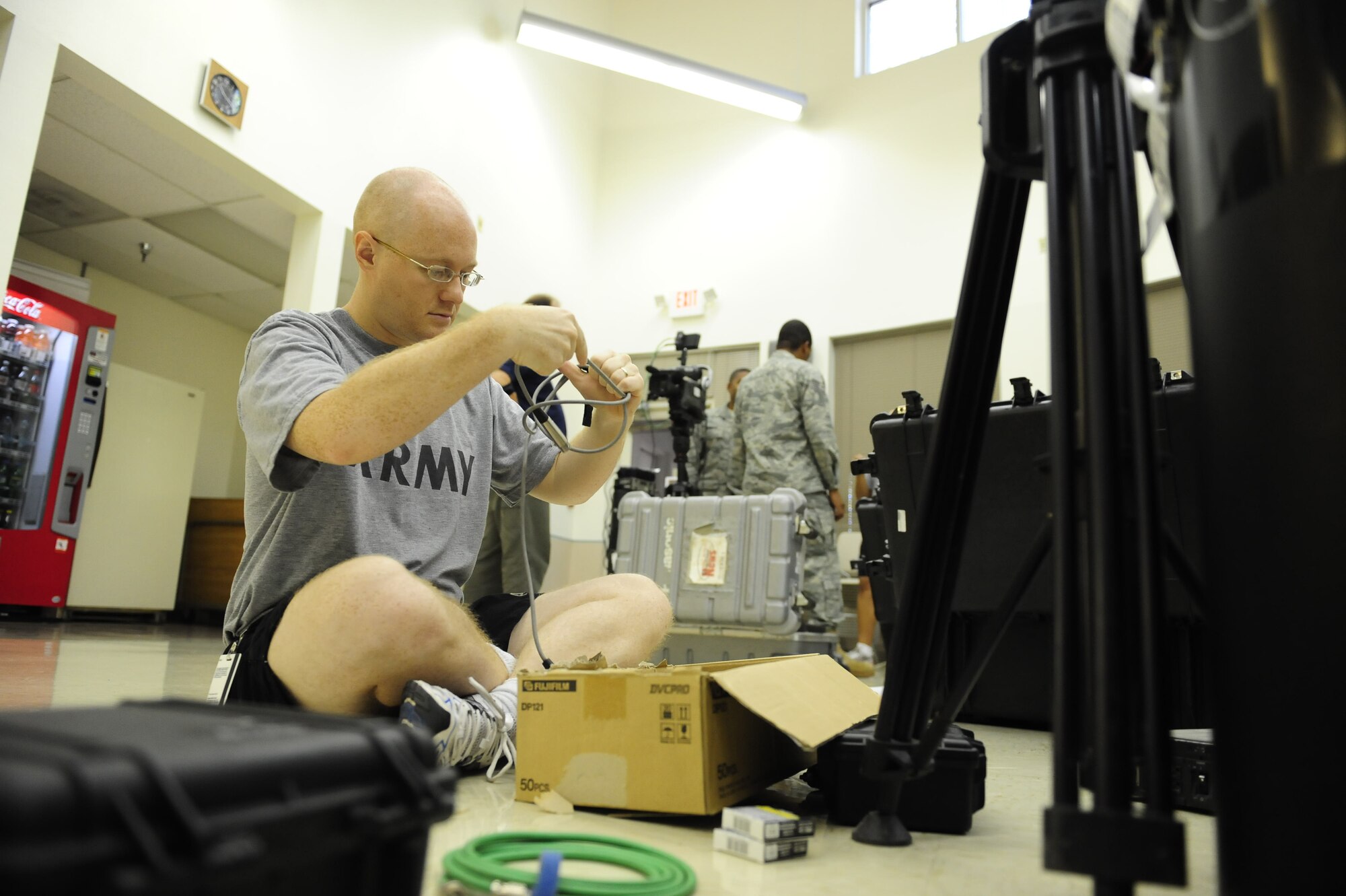 Army Spc. Andrew Branstad goes through equipment he'll need for his Southwest Asia leg of this year's holiday greetings taping Aug. 27, 2009.  Thousands of greetings will be sent to virtually every television and radio station in America for airing from Thanksgiving through New Year's Day.  Specialist Branstad is a broadcaster with the Joint Hometown News Service in San Antonio.  (U.S. Air Force photo/Senior Airman Christopher Griffin)