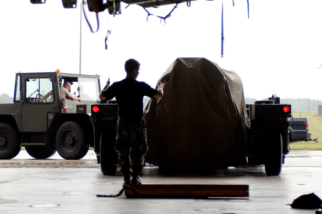 Members of the 509th Aircraft Maintenance Squadron back a weapons load trailer into a B-2 Spirit dock in preparation to load mock bombs into a B-2 bomb bay Aug. 17, 2009 at Whiteman Air Force Base, Mo. The weapons load is part of the 72nd Test and Evaluation Squadron's Combat Sledgehammer. (U.S. Air force photo/Staff Sgt. Jason Barebo) 