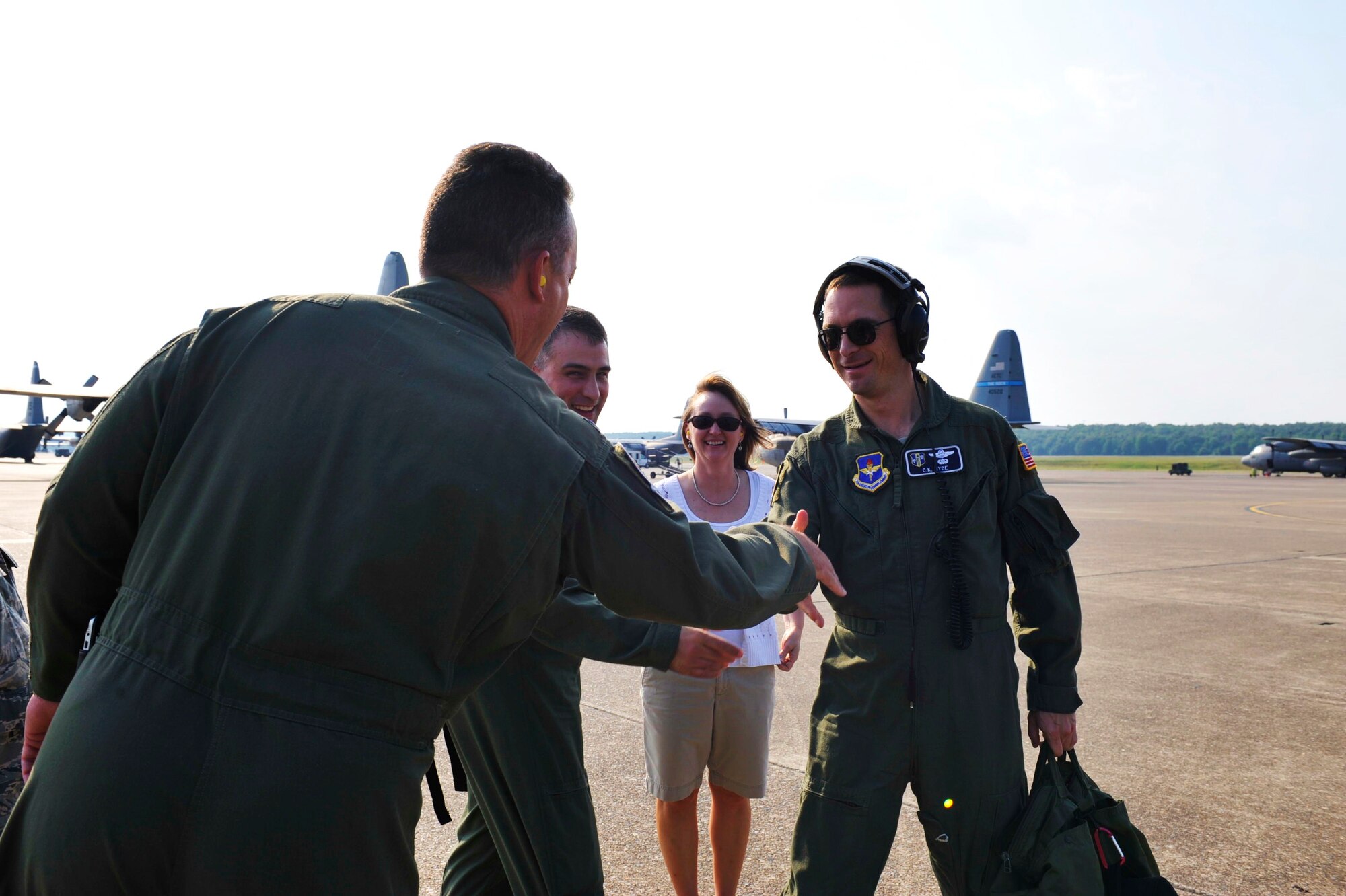 Col. C.K. Hyde, 314th Airlift Wing commander, is greeted by family and friends after completing his 4000th flight hour Aug. 27. (U.S. Air Force photo by Airman Lausanne Pacheco)