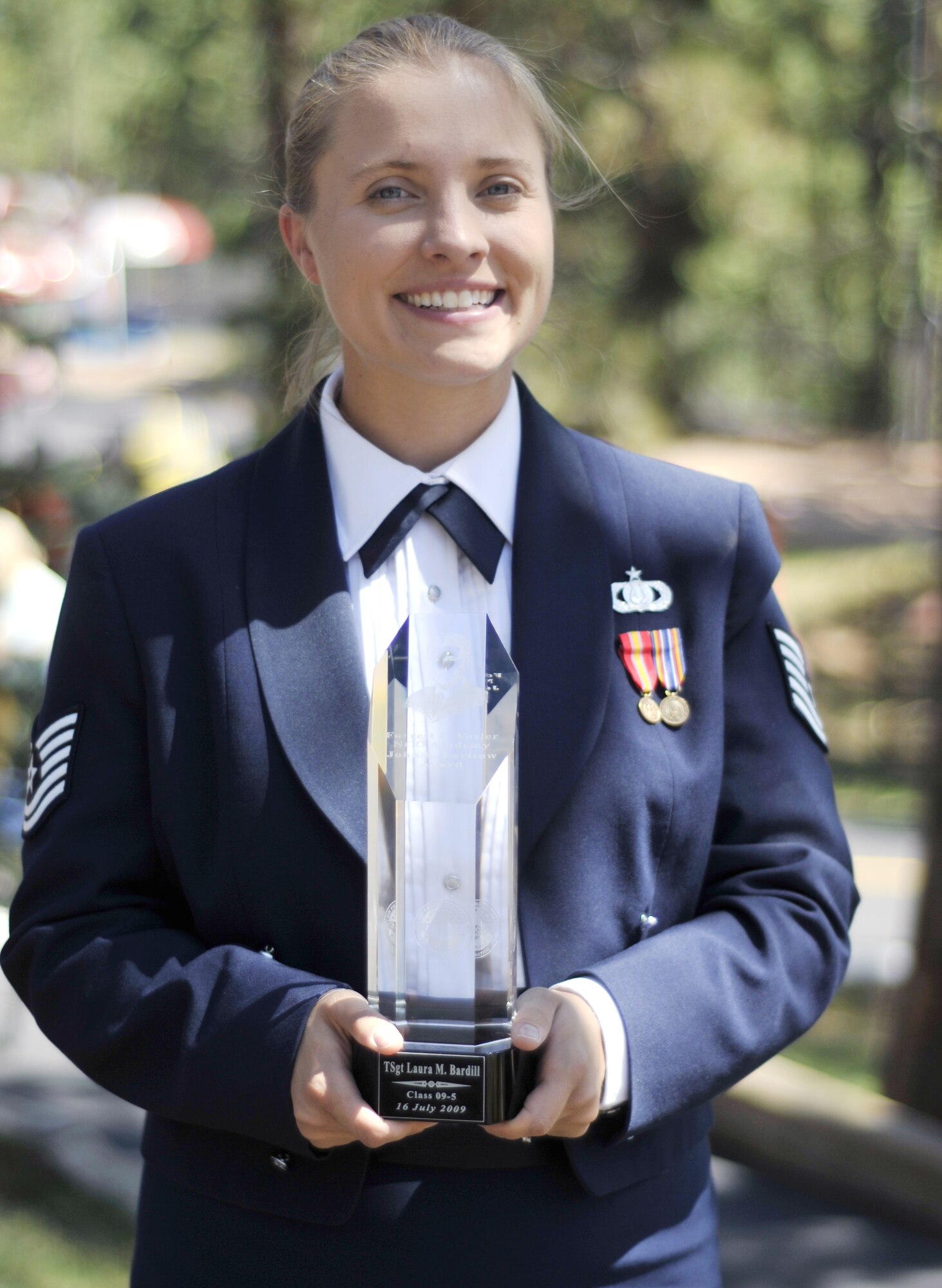 Tech. Sgt. Laura Bardill received the John L. Levitow Award for the Forrest L. Vosler NCO Academy's Class 09-5 during the NCO Academy's graduation ceremony at Peterson Air Force Base, Colo., July 16, 2009. Sergeant Bardill is a clarinetist with the Air Force Academy Band at Peterson AFB and a native of Hudson, Wis. (U.S. Air Force photo/Larry Hulst)