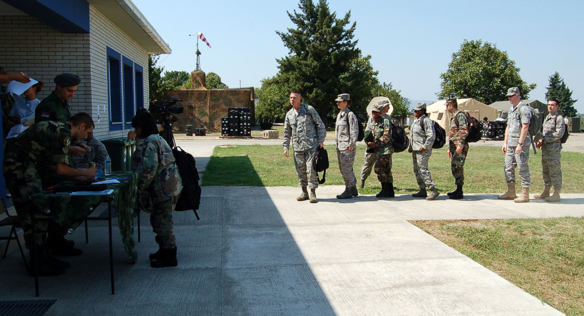 NIS, Serbia – Members of the Serbian Armed Forces Force Protection in-process Airmen Aug. 29 for participation in the military medical training exercise in Central and Europe, better known as MEDCEUR 2009, in Nis, Serbia. (U.S. Air Force photo/Senior Airman Kali L. Gradishar)