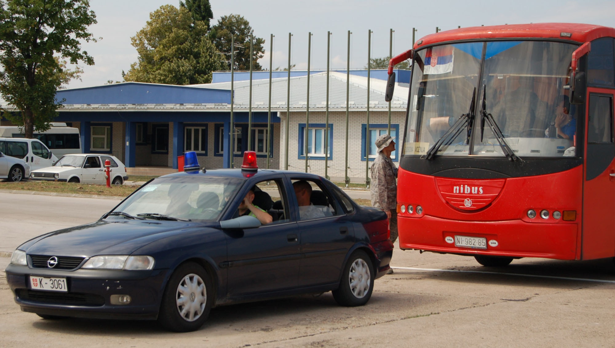 NIS, Serbia – A police escort waits for the departure of a bus carrying participants of MEDCEUR 2009, a military medical training exercise in Central and Eastern Europe, Aug. 31 after in-processing the group into the exercise, scheduled for Sept. 2-13. (U.S. Air Force photo/Senior Airman Kali L. Gradishar)