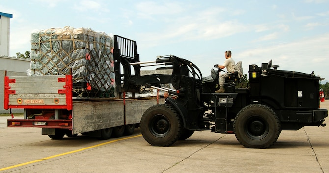 NIS, Serbia – Senior Airman Jared Politi, 435th Air Mobility Squadron, picks up a pallet of gear and equipment Aug. 31 for the military medical training exercise in Central and Eastern Europe, better known as MEDCEUR 2009, in Nis, Serbia. The medical exercise is scheduled for Sept. 2-13 near an airfield in Nic. (U.S. Air Force photo/Senior Airman Kali L. Gradishar)