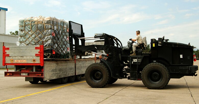 NIS, Serbia – Senior Airman Jared Politi, 435th Air Mobility Squadron, picks up a pallet of gear and equipment Aug. 31 for the military medical training exercise in Central and Eastern Europe, better known as MEDCEUR 2009, in Nis, Serbia. The medical exercise is scheduled for Sept. 2-13 near an airfield in Nic. (U.S. Air Force photo/Senior Airman Kali L. Gradishar)