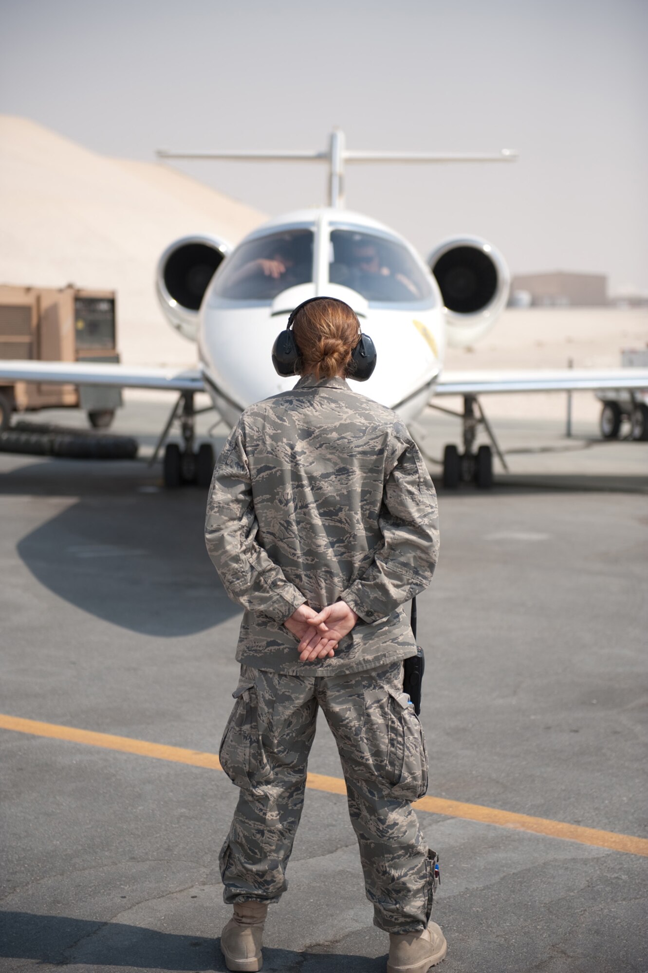 Staff Sgt. Michelle Urso, 379th Expeditionary Maintenance Squadron C-21 crew chief, helps with a final preflight check for a C-21, Aug. 28, in Southwest Asia. As a C-21 crew chief, Sergeant Urso supports the C-21 mission of providing quick airlift capabilities for personnel and equipment throughout the U.S. Central Command area of responsibility. Sergeant Urso is deployed from the Connecticut Air National Guard in support of Operations Iraqi and Enduring Freedom. (U.S. Air Force photo/Staff Sgt. Robert Barney)