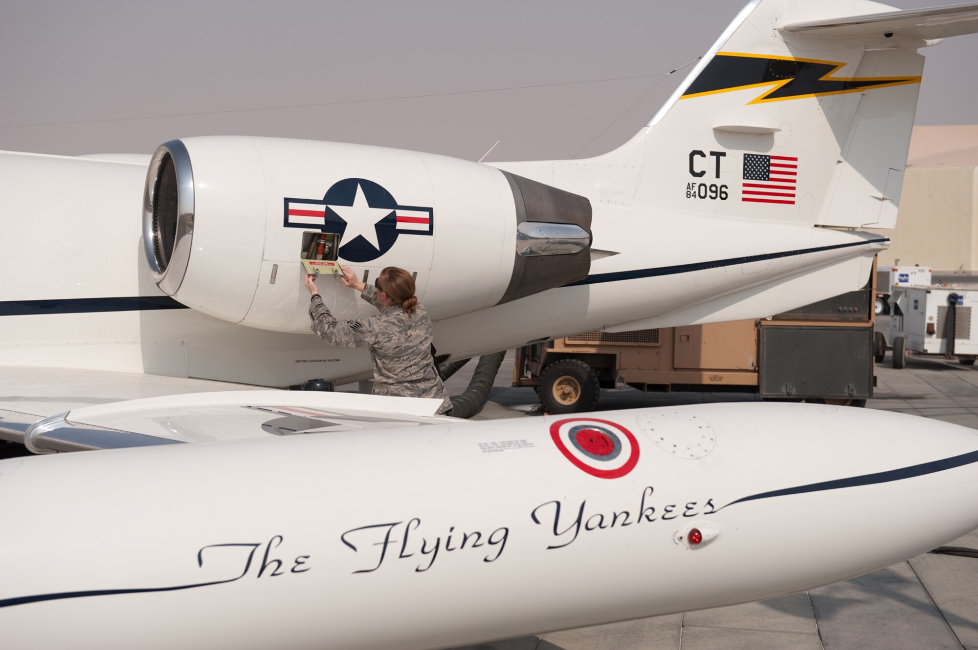 Staff Sgt. Michelle Urso, 379th Expeditionary Maintenance Squadron C-21 crew chief, prepares an aircraft for flight, Aug. 28, in Southwest Asia. As a crew chief, Sergeant Urso supports the C-21 mission of providing quick airlift capabilities for personnel and equipment throughout the U.S. Central Command area of responsibility. Sergeant Urso is deployed from the Connecticut Air National Guard in support of Operations Iraqi and Enduring Freedom. (U.S. Air Force photo/Staff Sgt. Robert Barney)