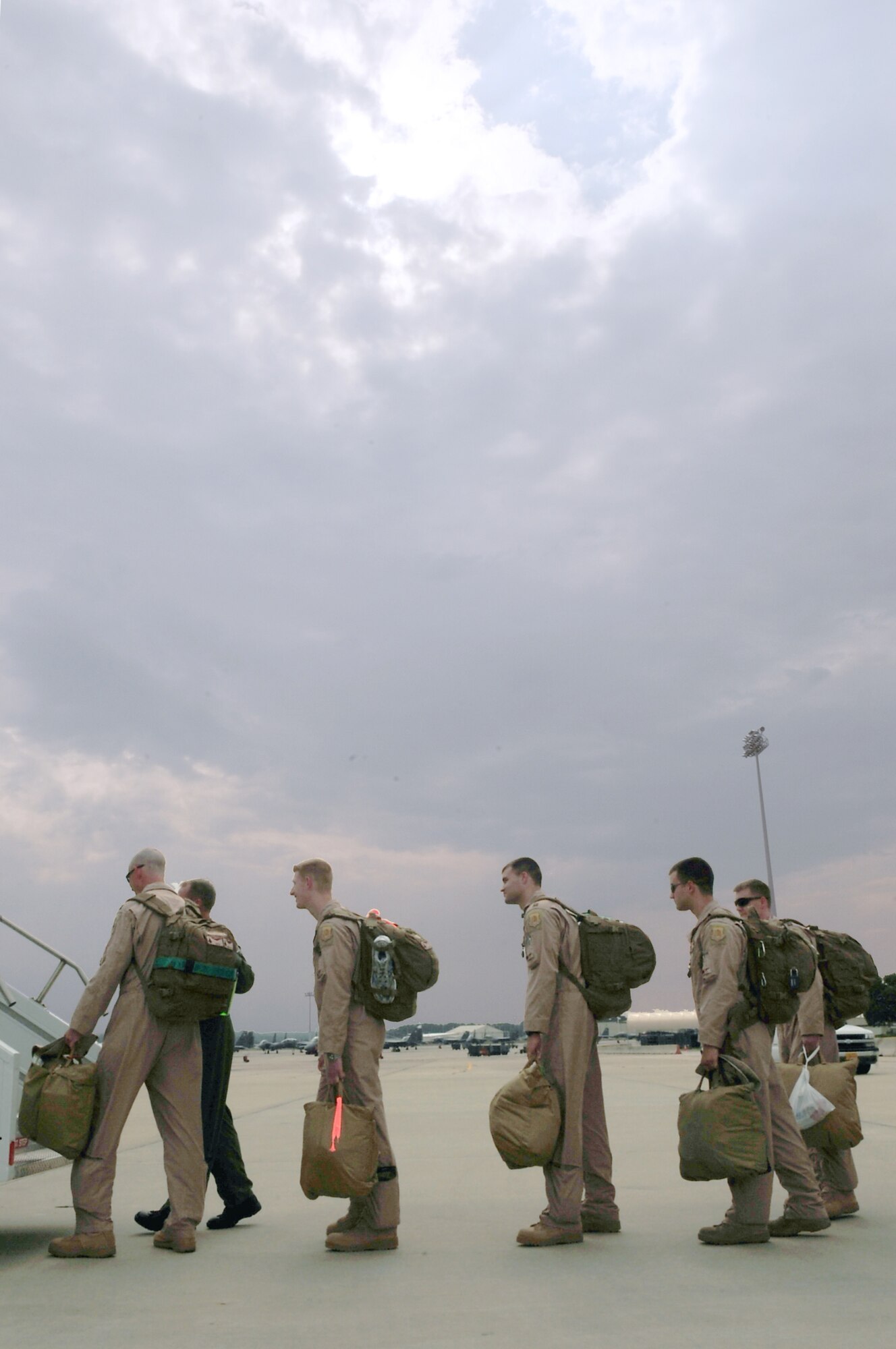 Airmen from the 335th Fighter Squadron wait to board an aircraft bound for Afghanistan on Seymour Johnson Air Force Base, N.C. Aug. 30, 2009. The 335th FS will assume flying operations from the 336th Fighter Squadron who left here in April. (U.S. Air Force photo by Airman 1st Class Rae Perry)
