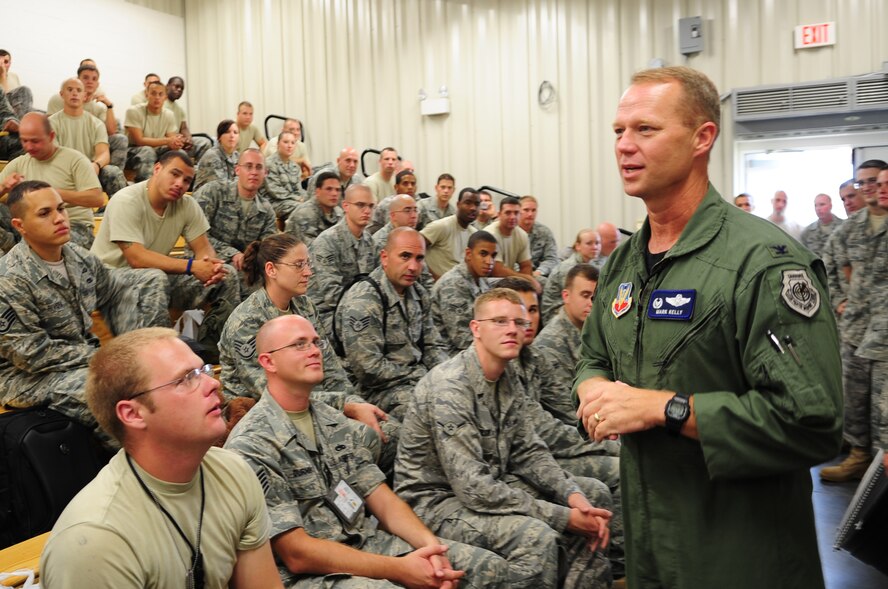 Col. Mark Kelly, 4th Fighter Wing commander, talks to members of the 335th Fighter Squadron and 335th Aircraft Maintenance Unit on Seymour Johnson Air Force Base, N.C., Aug. 30. About 300 members of the 335th FS and 335th AMU deployed to Afghanistan in support of Operation Enduring Freedom. (U.S. Air Force photo/Airman 1st Class Rae Perry)