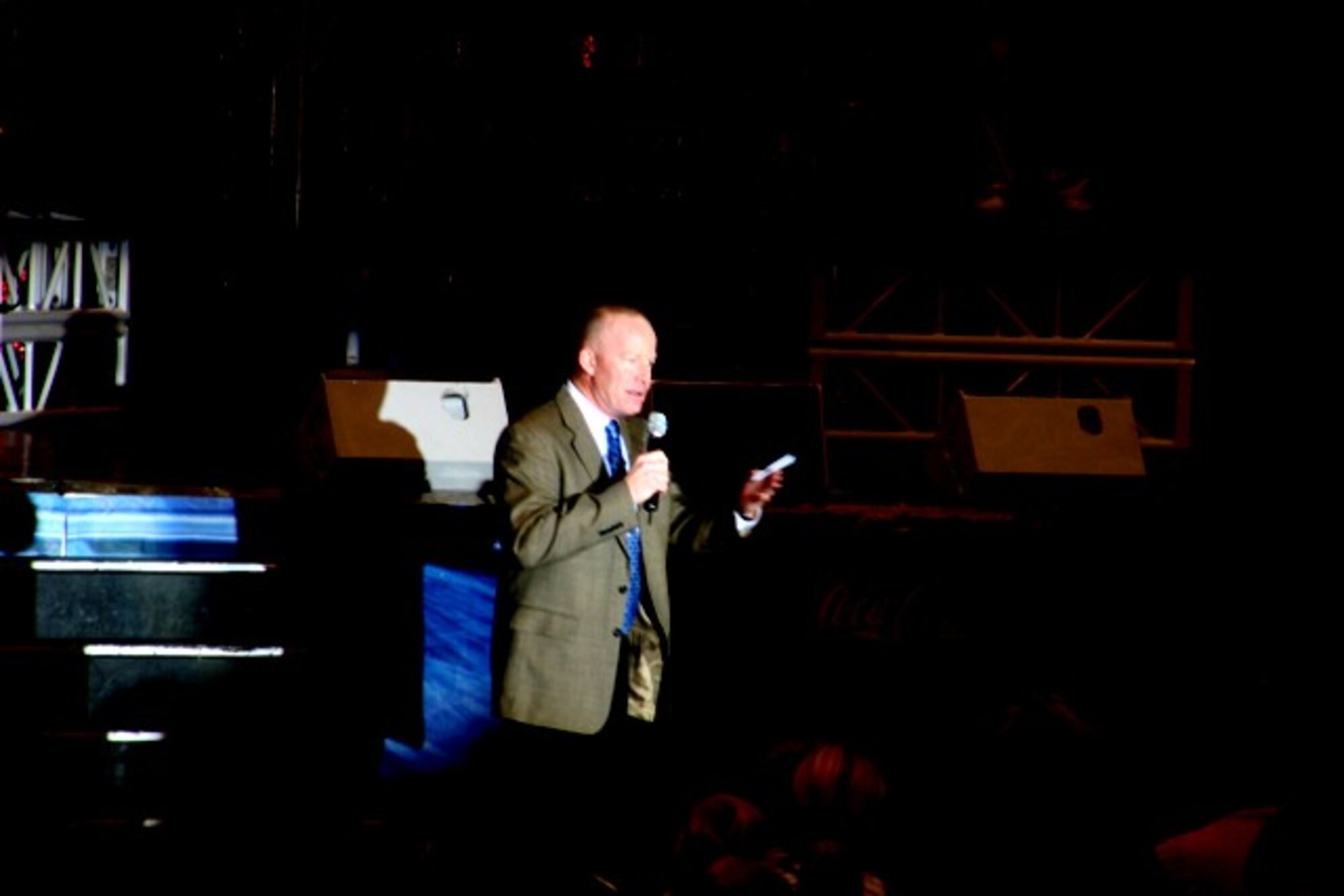 Col. Gary Goldstone, 375th Airlift Wing commander, provides welcome remarks during the opening of the Tops in Blue performance at Scott Air Force Base, Ill., on Aug. 31, 2009.  Tops in Blue, the Air Force's premier entertainment showcase, serves as an expeditionary entertainment unit to provide quality entertainment from within Air Force resources for the Air Force family, with priority to Air Force personnel stationed worldwide at remote and deployed locations while simultaneously promoting community relations, supporting recruiting efforts and serving as ambassadors for the United States of America and the United States Air Force. (U.S. Air Force Photo/Tech. Sgt. Scott T. Sturkol)