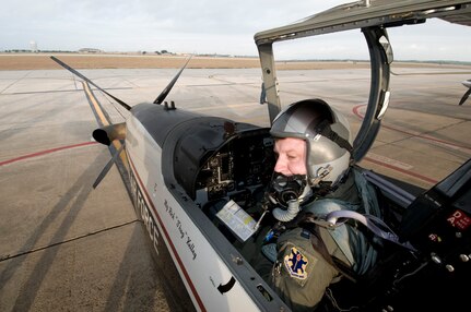 Capt. Damien Ludwick, 559th FTS, completes a pre-flight check prior to a training flight in a T-6 Texan II at Randolph AFB, Texan. (U.S. Air Force photo/Dave Terry)