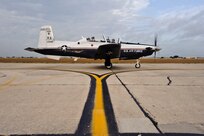 A T-6 Texan II assigned to the 559th Flying Training Squadron taxi towards the runway prior to a Pilot Instructor Training sortie at Randolph Air Force Base, Texas.  (U.S. Air Force photo/Steve Thurow)