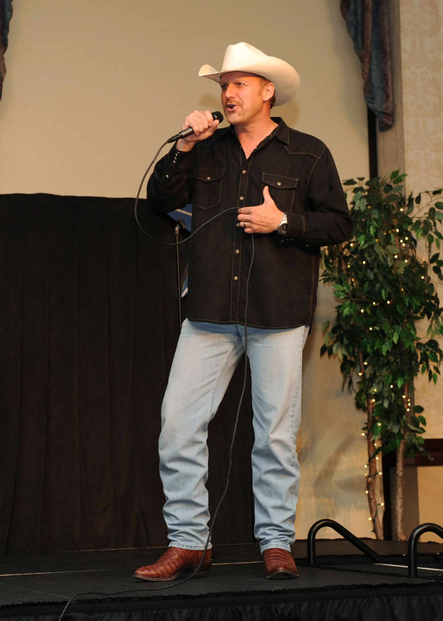 SCOTT AIR FORCE BASE, Ill. -- Retired Senior Master Sgt. Richard King sings "God Loves Her" by Toby Keith. His performance earned him first place in the competition and $500.   (U.S. Air Force photo/ Tech. Sgt. Michelle Larche)